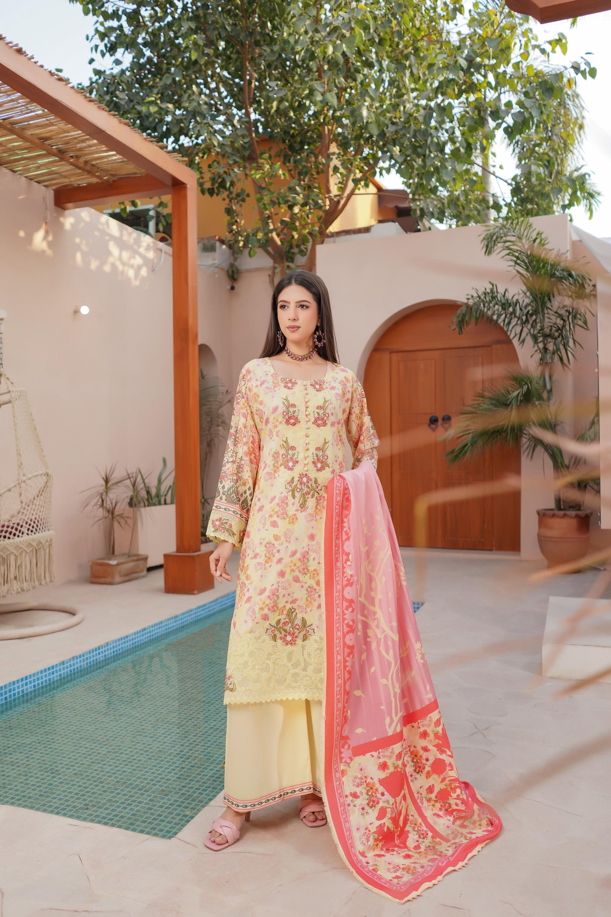 Traditional Pakistani Salwar Kameez for women featuring intricate embroidery and vibrant colors, by Saree Ghor Charlotte.