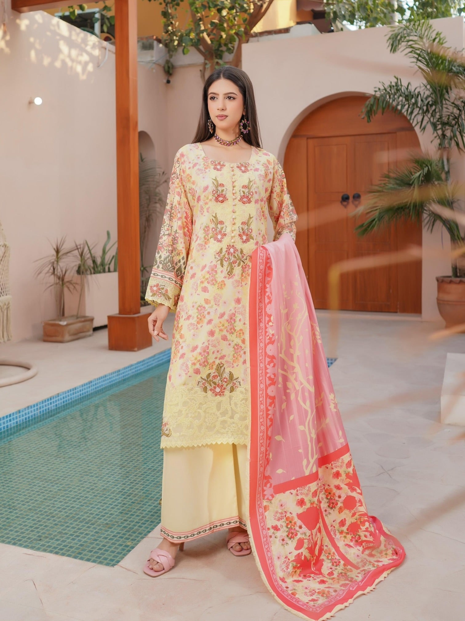 Traditional Pakistani Salwar Kameez from Saree Ghor Charlotte, featuring vibrant fabric and intricate embroidery for cultural wear.