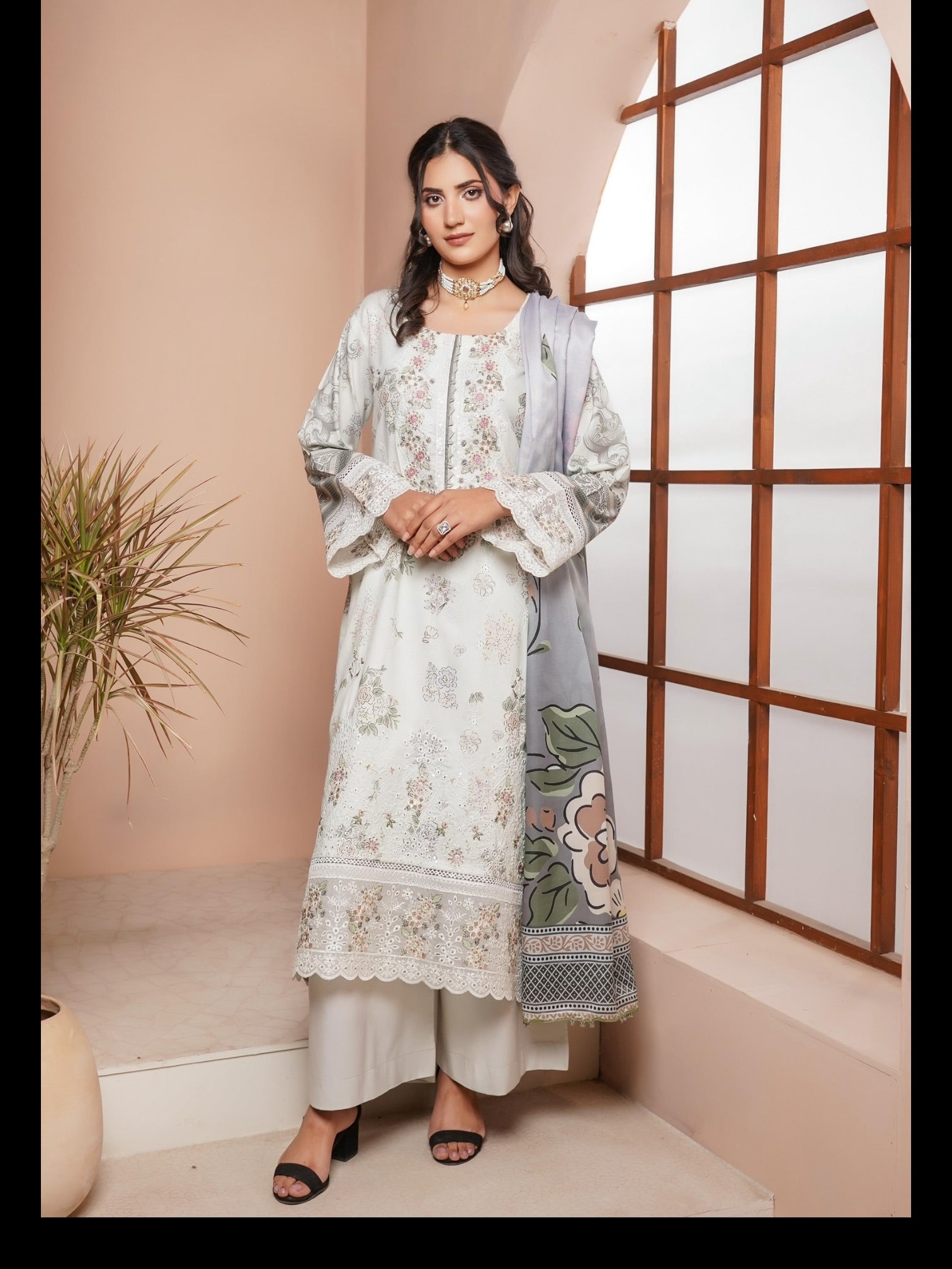 Traditional Pakistani Salwar Kameez by Saree Ghor Charlotte, featuring colorful fabric and intricate embroidery for cultural wear.