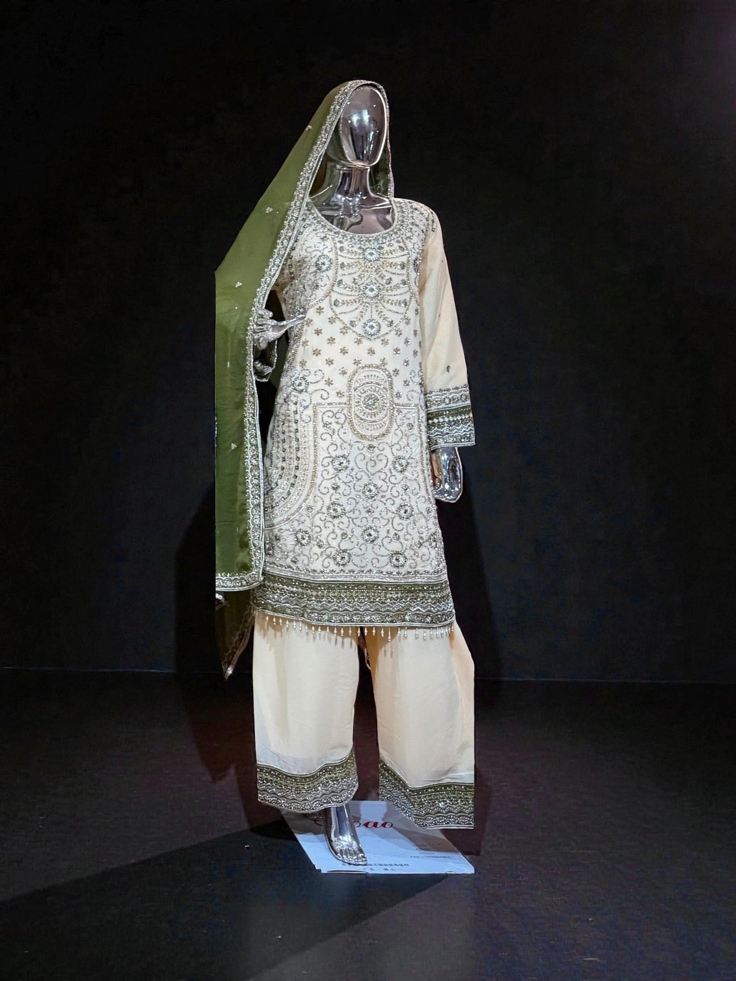Traditional Salwar Kameez by Saree Ghor Charlotte featuring elegant embroidery and vibrant colors, cultural wear for women.