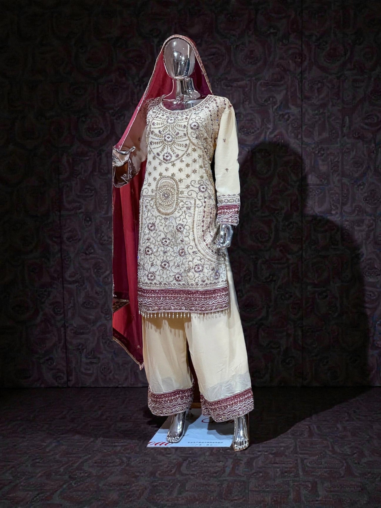 Traditional Salwar Kameez by Saree Ghor Charlotte, featuring colorful embroidered fabric and elegant fit for women’s cultural wear.