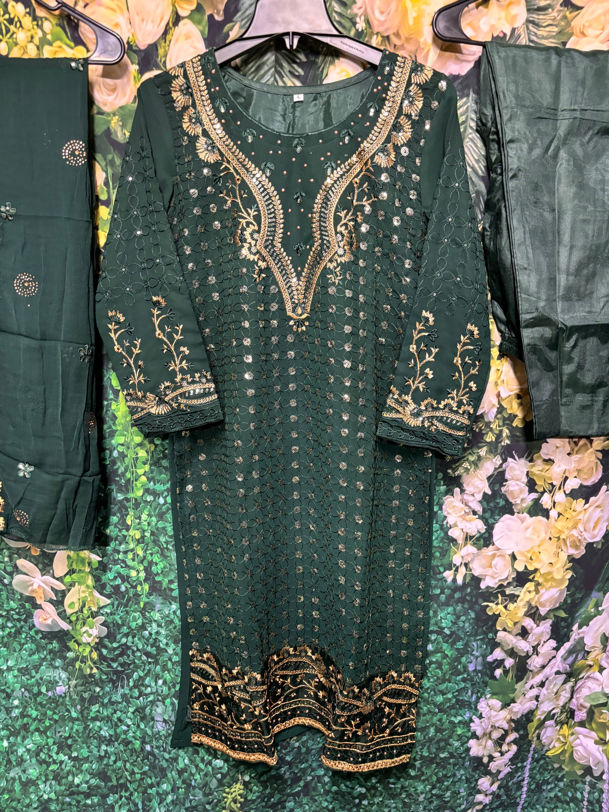 Faux georgette traditional women's salwar kameez with intricate embroidery, cultural wear from Saree Ghor Charlotte.