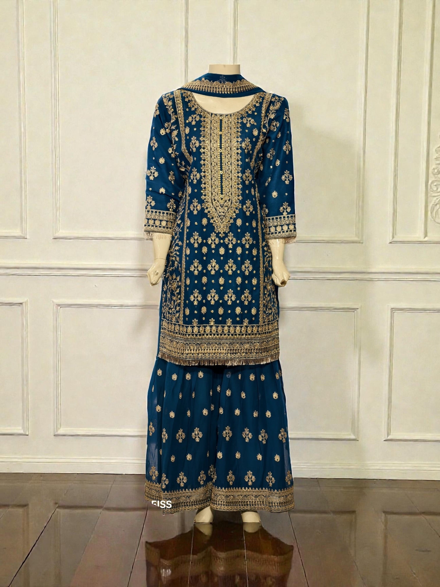Traditional Salwar Kameez for women by Saree Ghor Charlotte, featuring vibrant cultural wear with intricate embroidery and flowing fabric.