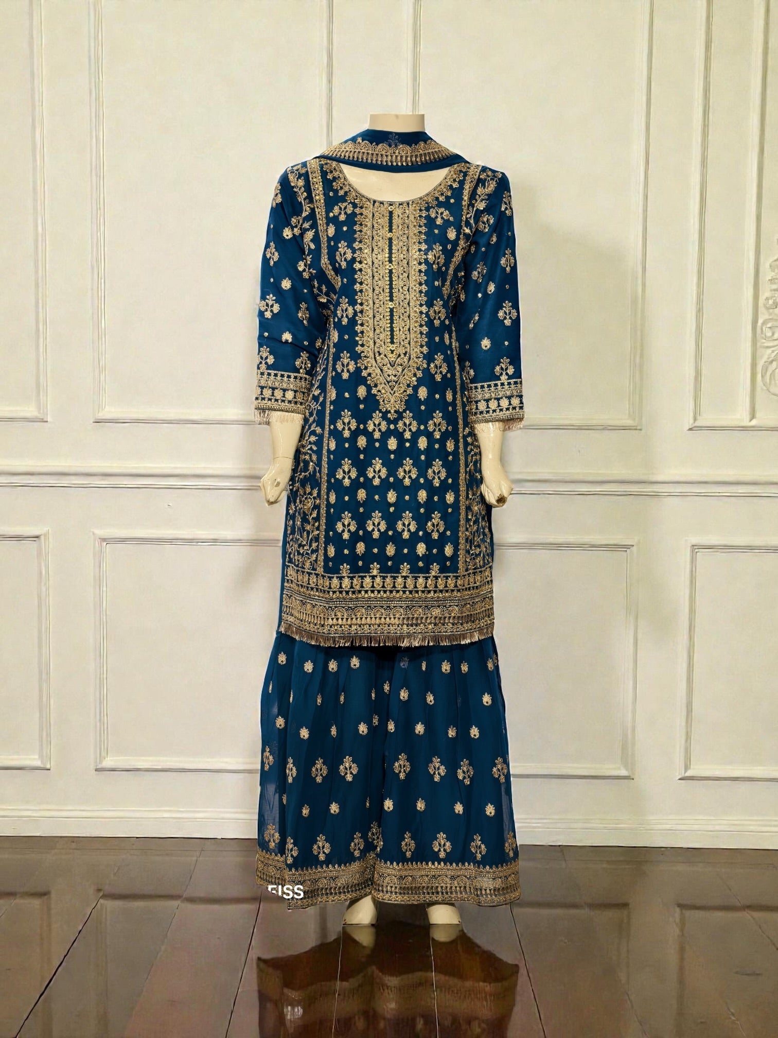 Traditional Salwar Kameez for women by Saree Ghor Charlotte, featuring vibrant cultural wear with intricate embroidery and flowing fabric.