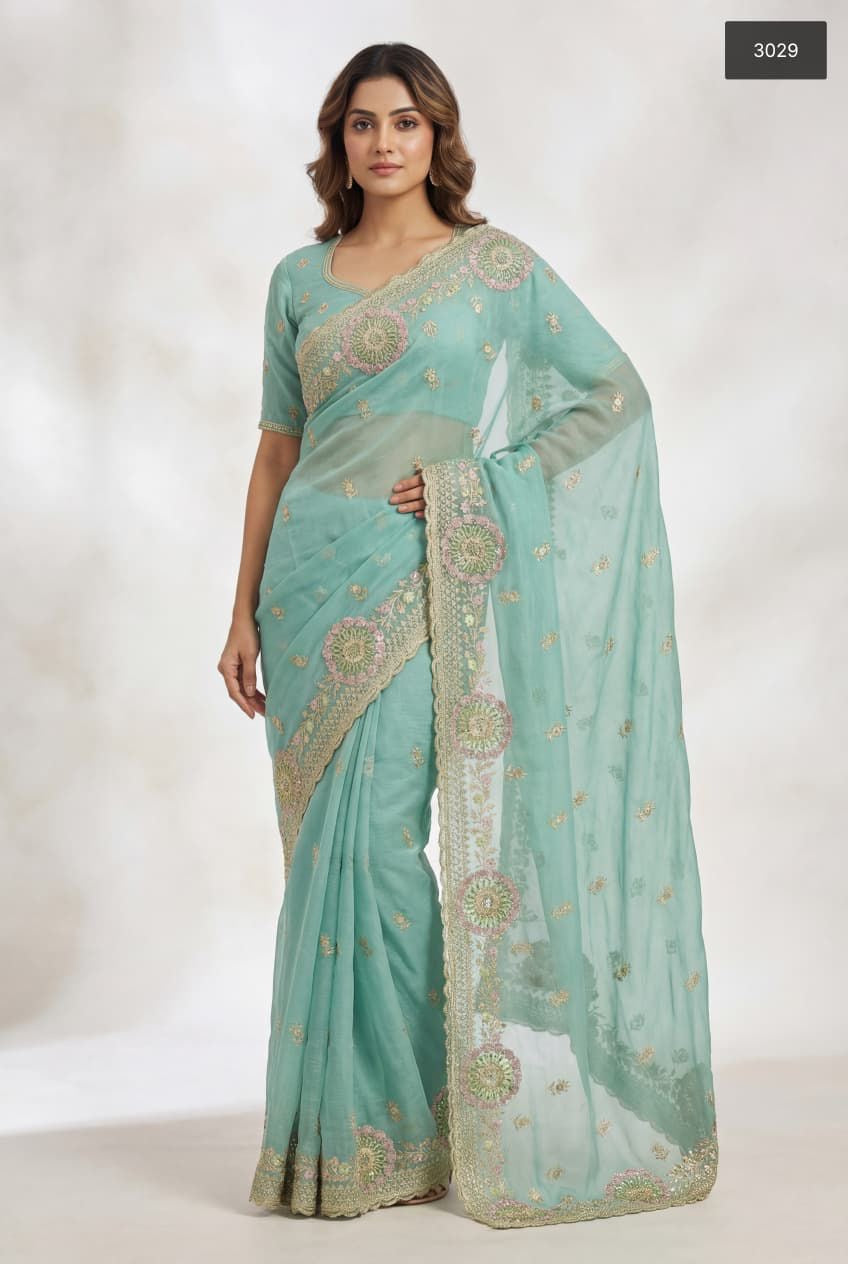 Traditional Simmer Saree by Saree Ghor Charlotte, showcasing vibrant fabric and intricate draping details for women's cultural wear.
