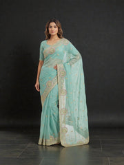 Traditional Saree by Saree Ghor Charlotte featuring intricate embroidery and vibrant colors for cultural women's wear.