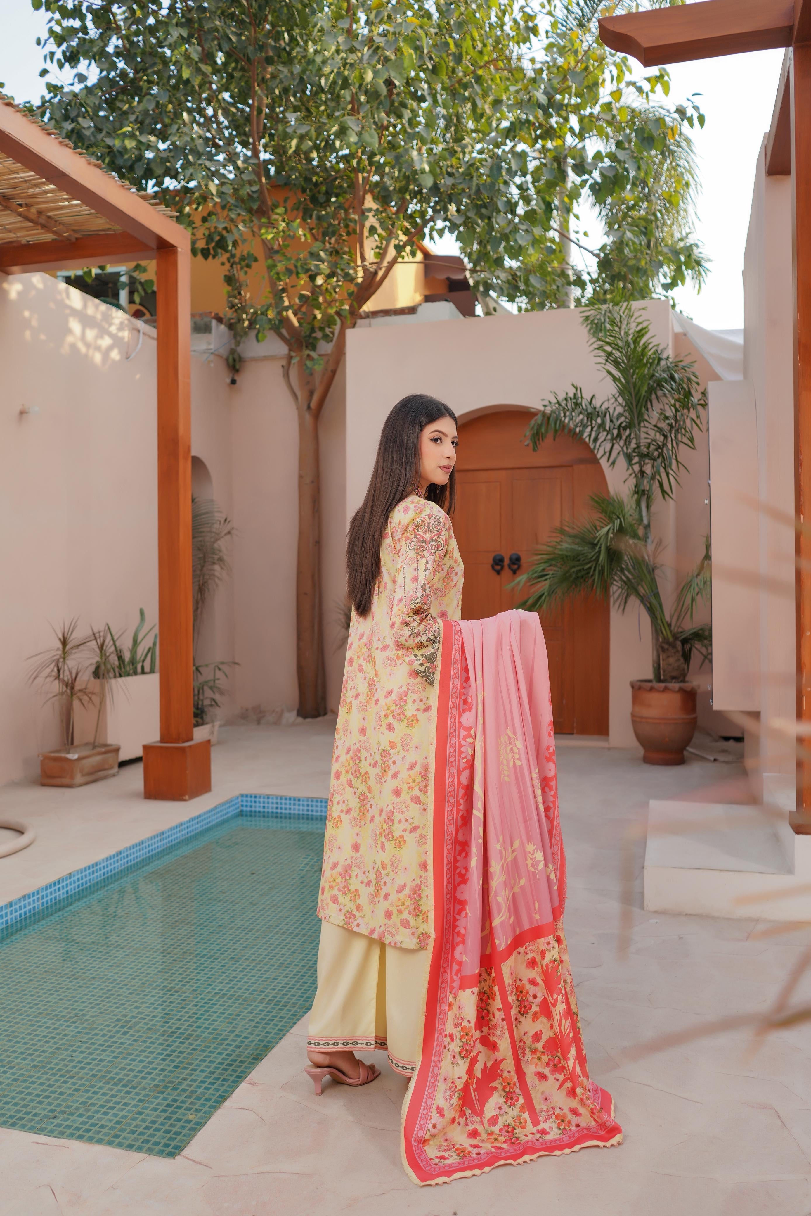 Traditional Pakistani Salwar Kameez for women, featuring vibrant fabric and intricate embroidery, by Saree Ghor Charlotte.