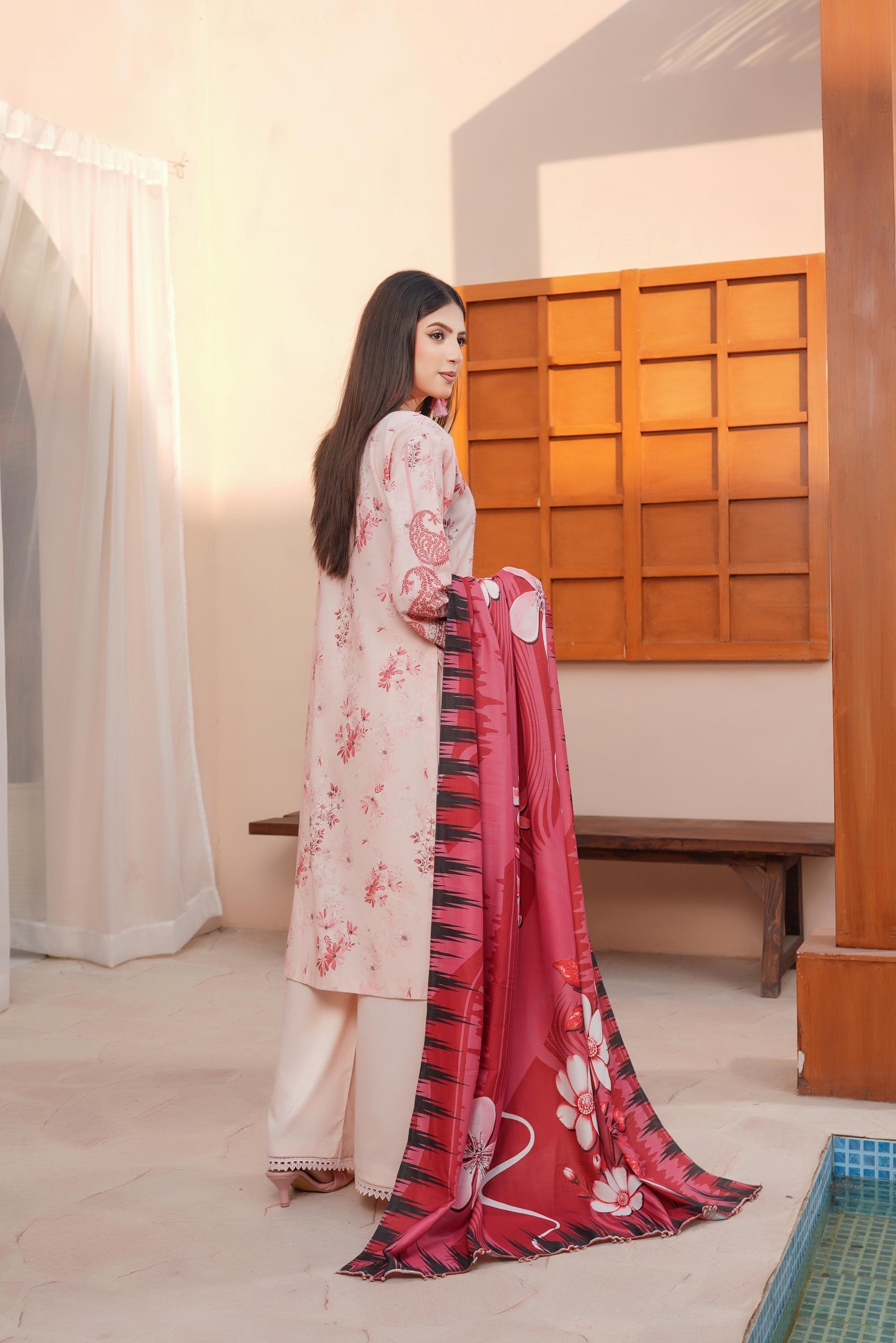 Traditional Pakistani Salwar Kameez for women featuring vibrant embroidery and elegant fabric, by Saree Ghor Charlotte.