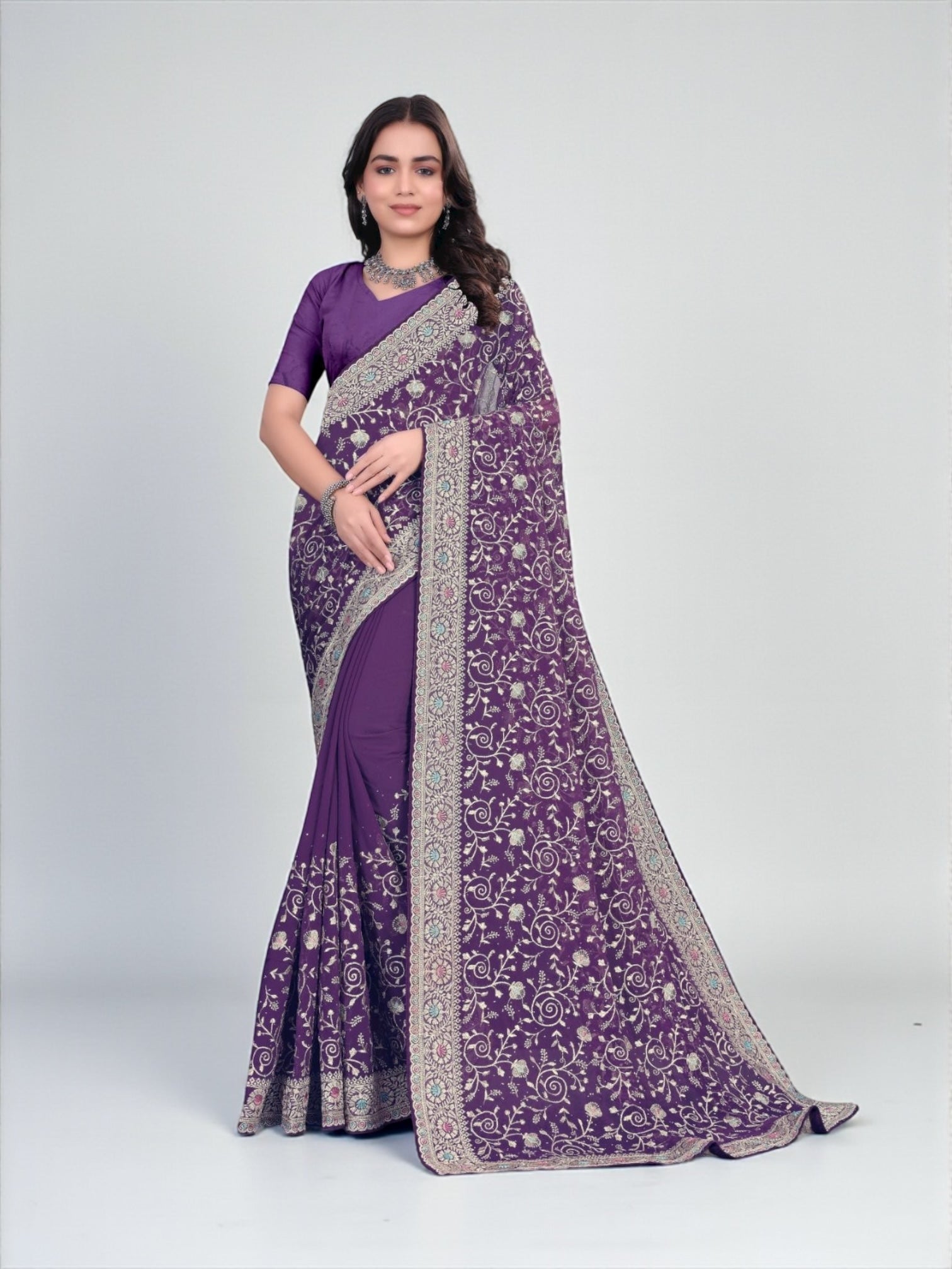 Traditional Georgette Saree by Saree Ghor Charlotte featuring intricate embroidery and vibrant colors for cultural wear.