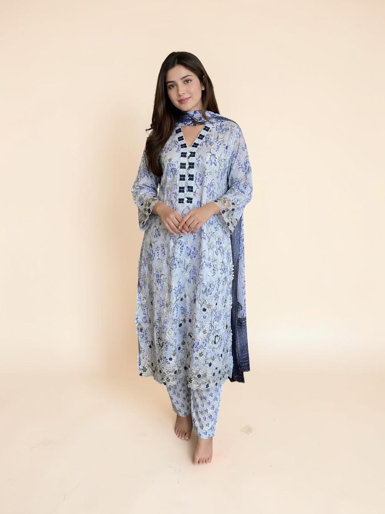 Traditional Pakistani Salwar Kameez by Saree Ghor Charlotte, vibrant cultural wear for women, showcasing intricate design and colorful fabric.