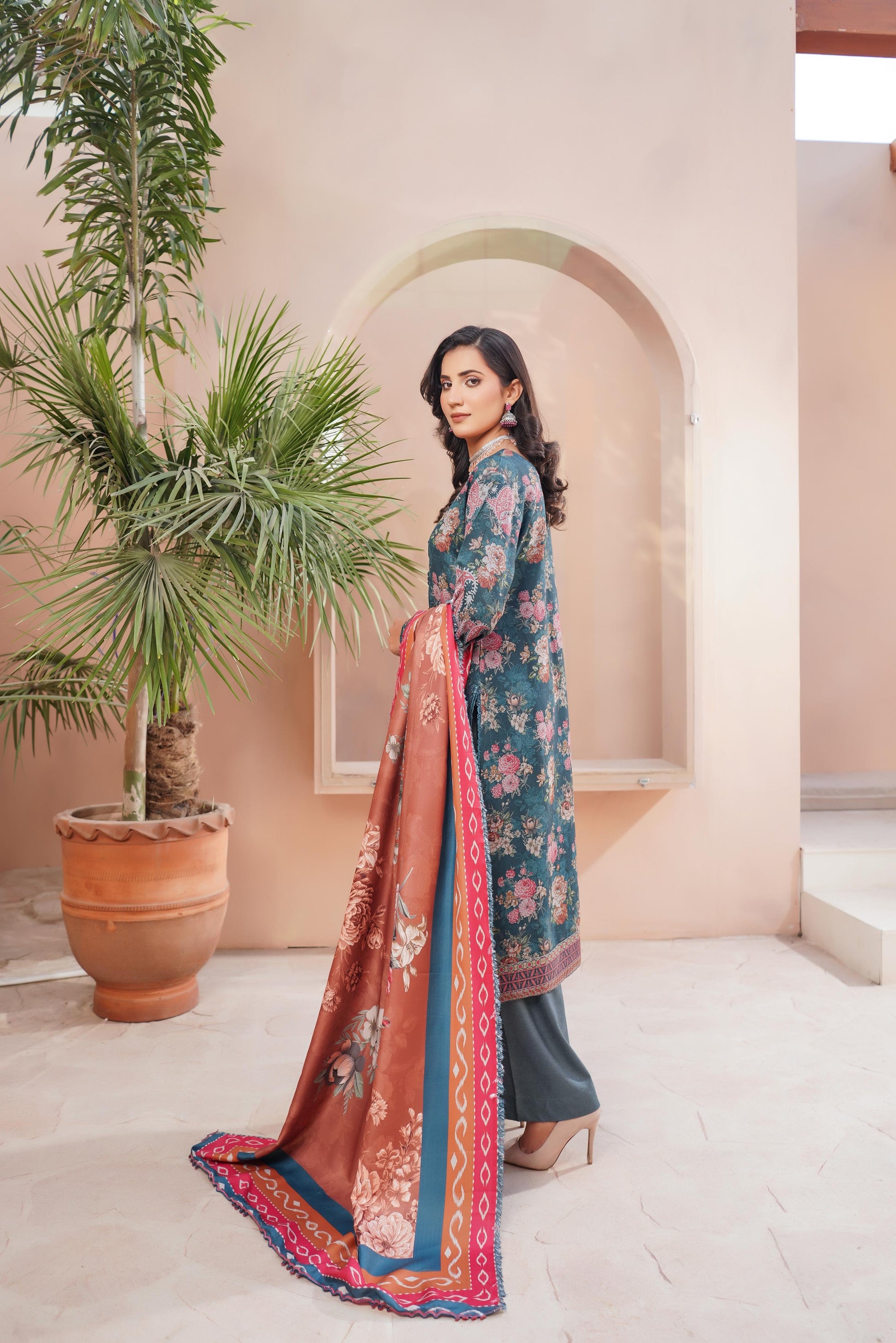 Traditional Pakistani Salwar Kameez for women by Saree Ghor Charlotte, featuring intricate embroidery and vibrant cultural design.