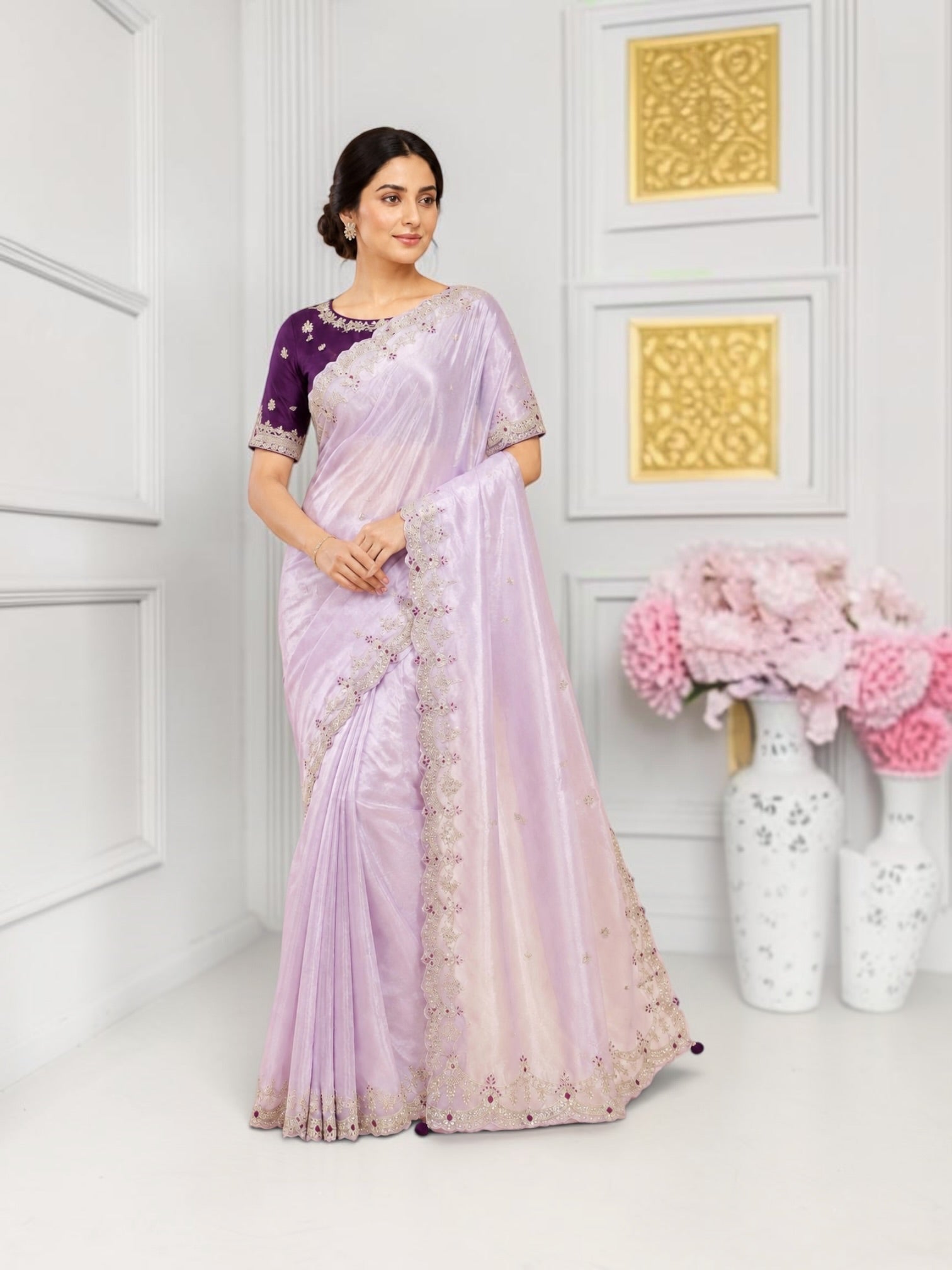 Elegant designer saree with a ready blouse from Saree Ghor Charlotte, featuring intricate traditional patterns for women.