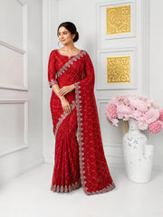Elegant designer net saree with intricate embroidery and matching ready blouse from Saree Ghor Charlotte, perfect for cultural occasions.