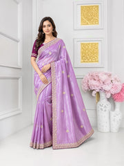 Traditional Saree by Saree Ghor Charlotte featuring vibrant cultural patterns and elegant drape for women.