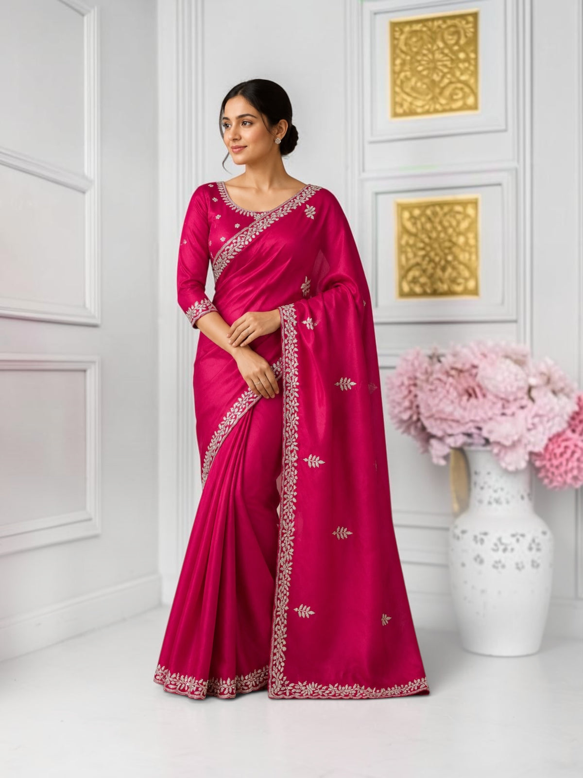 Elegant designer saree with ready blouse from Saree Ghor Charlotte, showcasing intricate fabric and traditional styling for women.