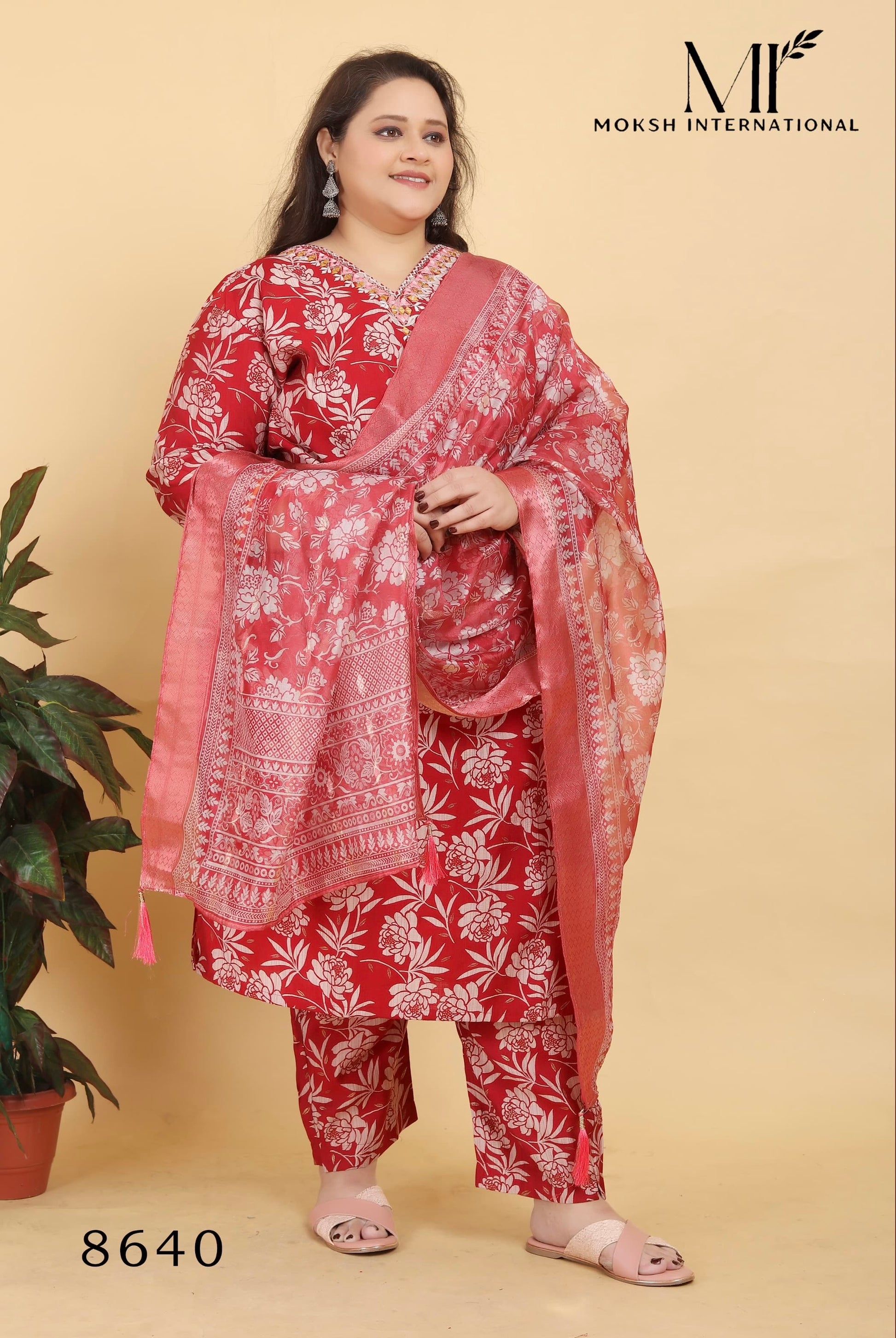 Traditional Salwar Kameez by Saree Ghor Charlotte featuring vibrant fabric and intricate embroidery for women's cultural wear.