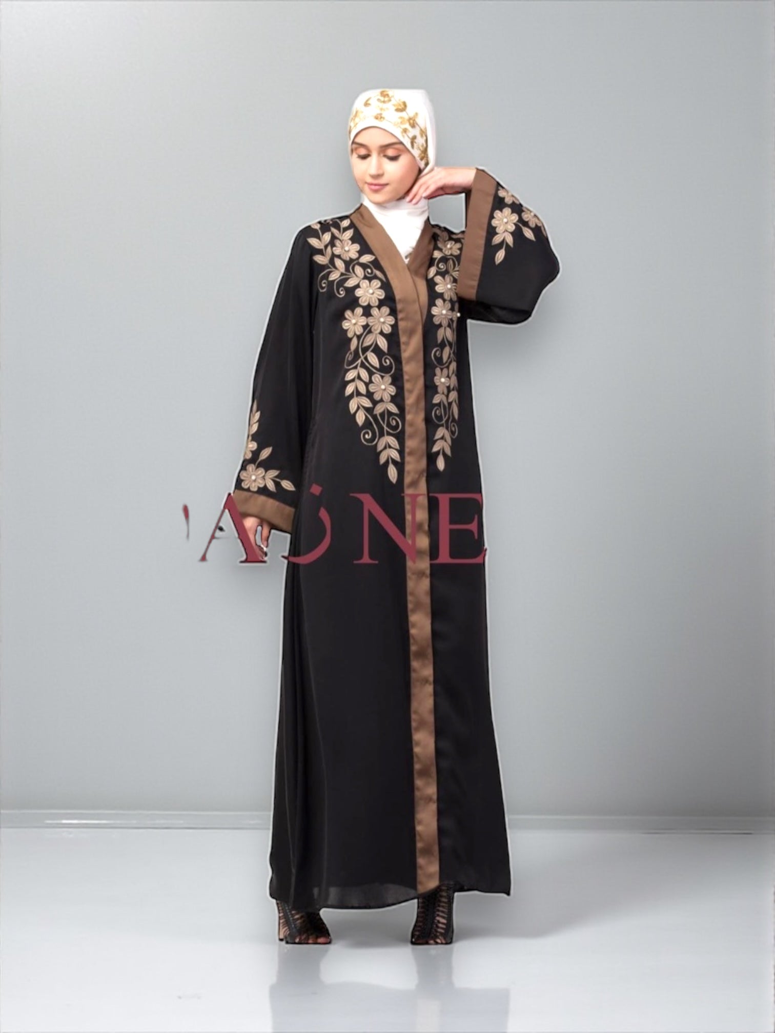 Women’s black Abaya Burqa by Saree Ghor Charlotte, modest Islamic dress with flowing fabric and elegant design.