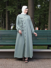 Women’s black Abaya Burqa by Saree Ghor Charlotte, modest Islamic dress with flowing fabric and elegant design.