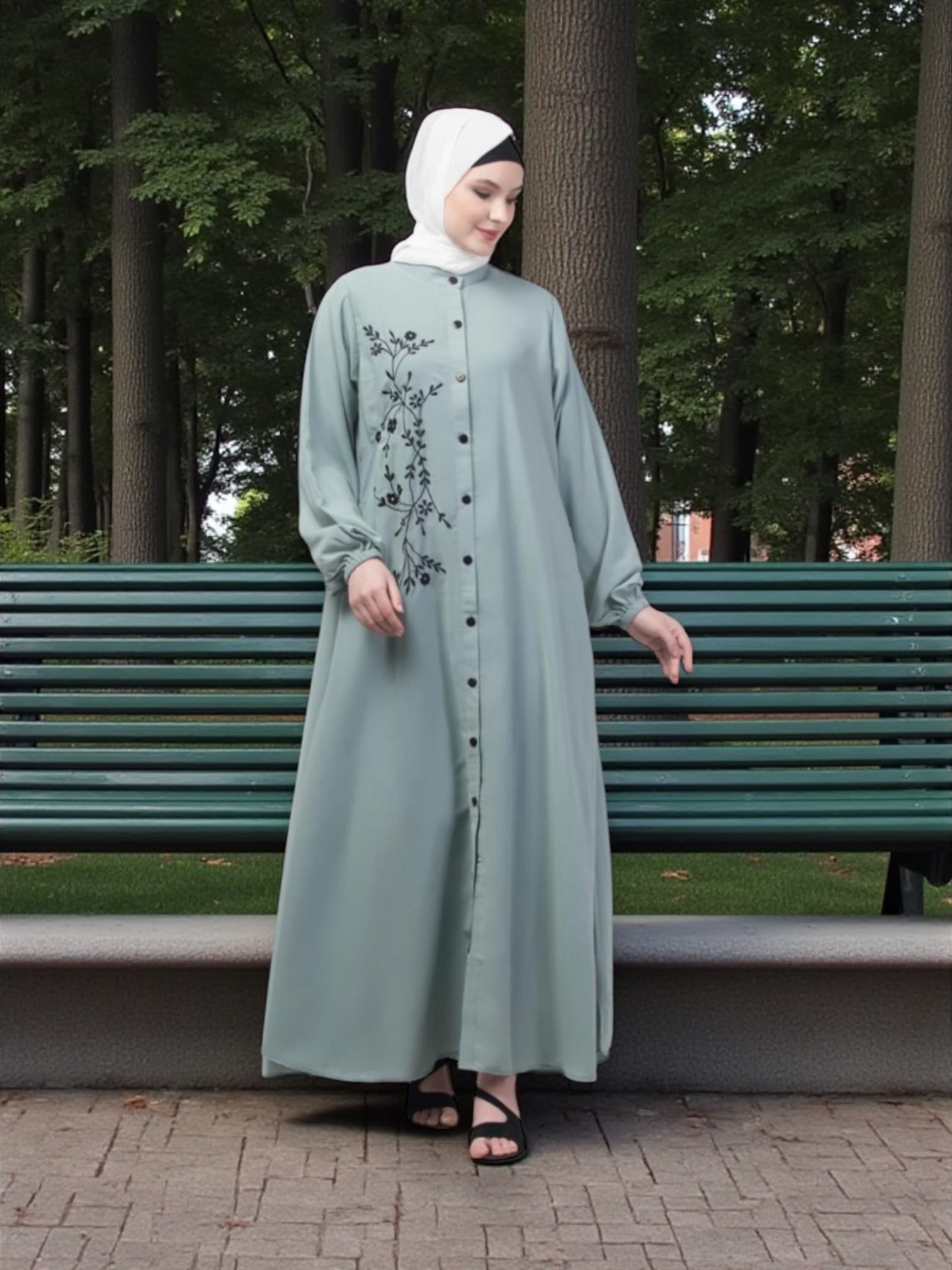 Women’s black Abaya Burqa by Saree Ghor Charlotte, modest Islamic dress with flowing fabric and elegant design.