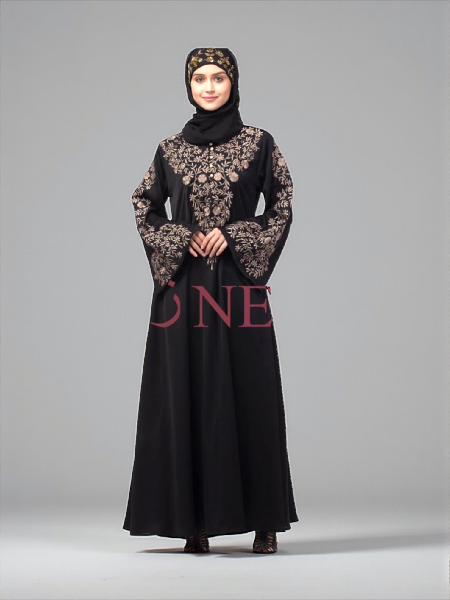 Women’s black Abaya Burqa by Saree Ghor Charlotte, modest Islamic dress with intricate embroidery, full-length and flowing.
