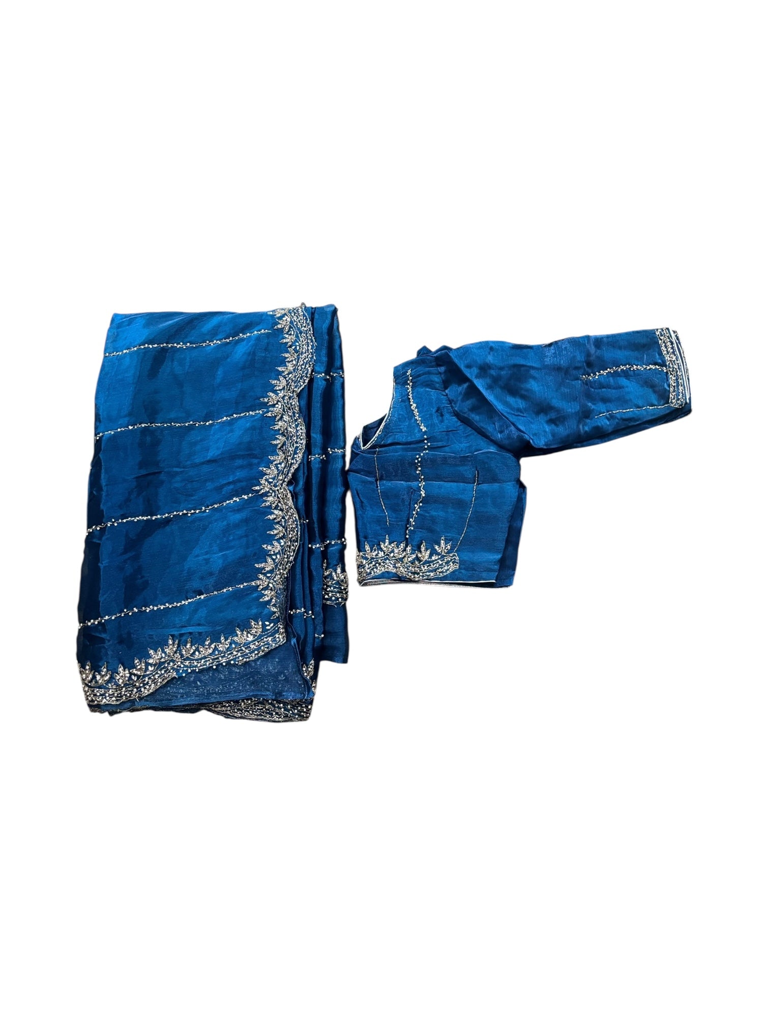 Elegant designer saree with ready blouse from Saree Ghor Charlotte, featuring intricate traditional patterns for women.