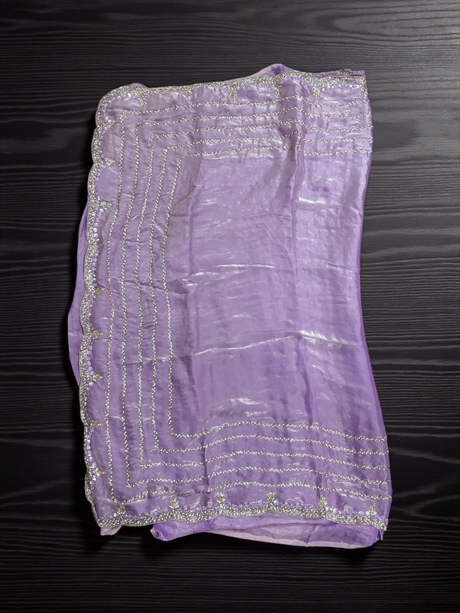 Elegant designer saree with ready blouse from Saree Ghor Charlotte, showcasing intricate traditional fabric and vibrant colors.