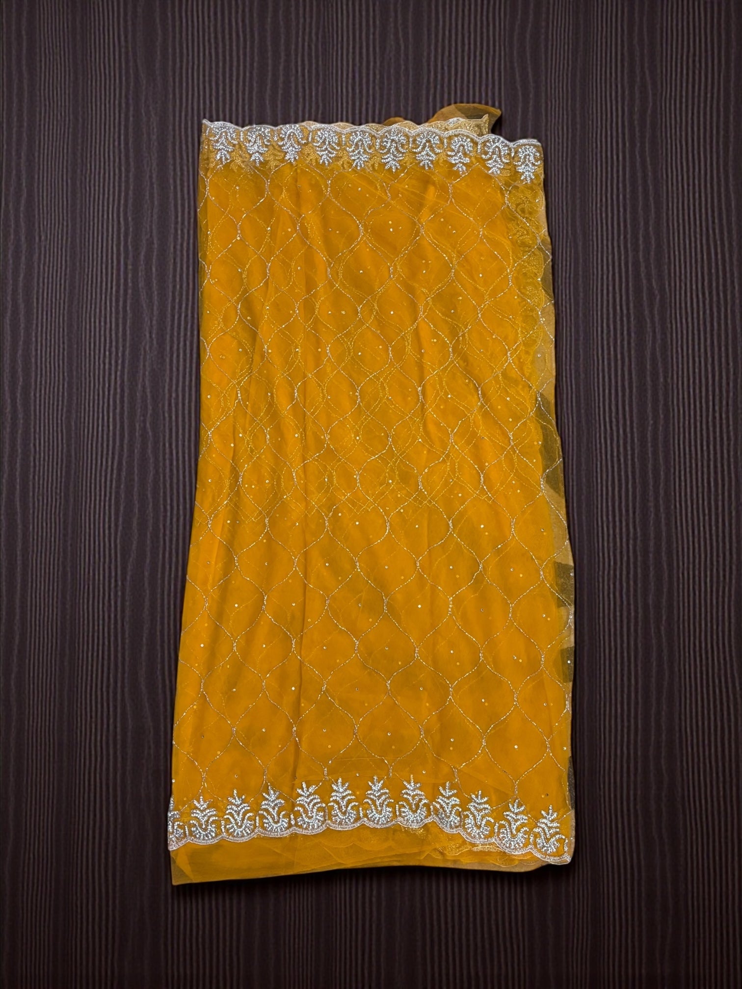 Elegant designer net saree with ready blouse by Saree Ghor Charlotte, perfect for cultural wear for women.