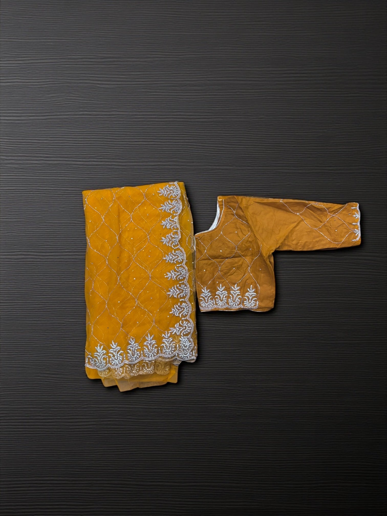 Elegant designer net saree with matching ready blouse from Saree Ghor Charlotte, cultural wear for women, detailed net fabric.