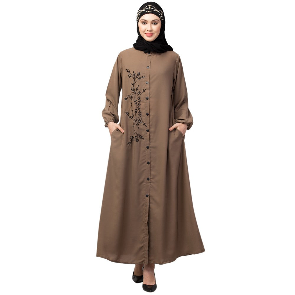 Women’s black Abaya Burqa by Saree Ghor Charlotte, modest Islamic dress with flowing fabric and elegant design, shown on a model.