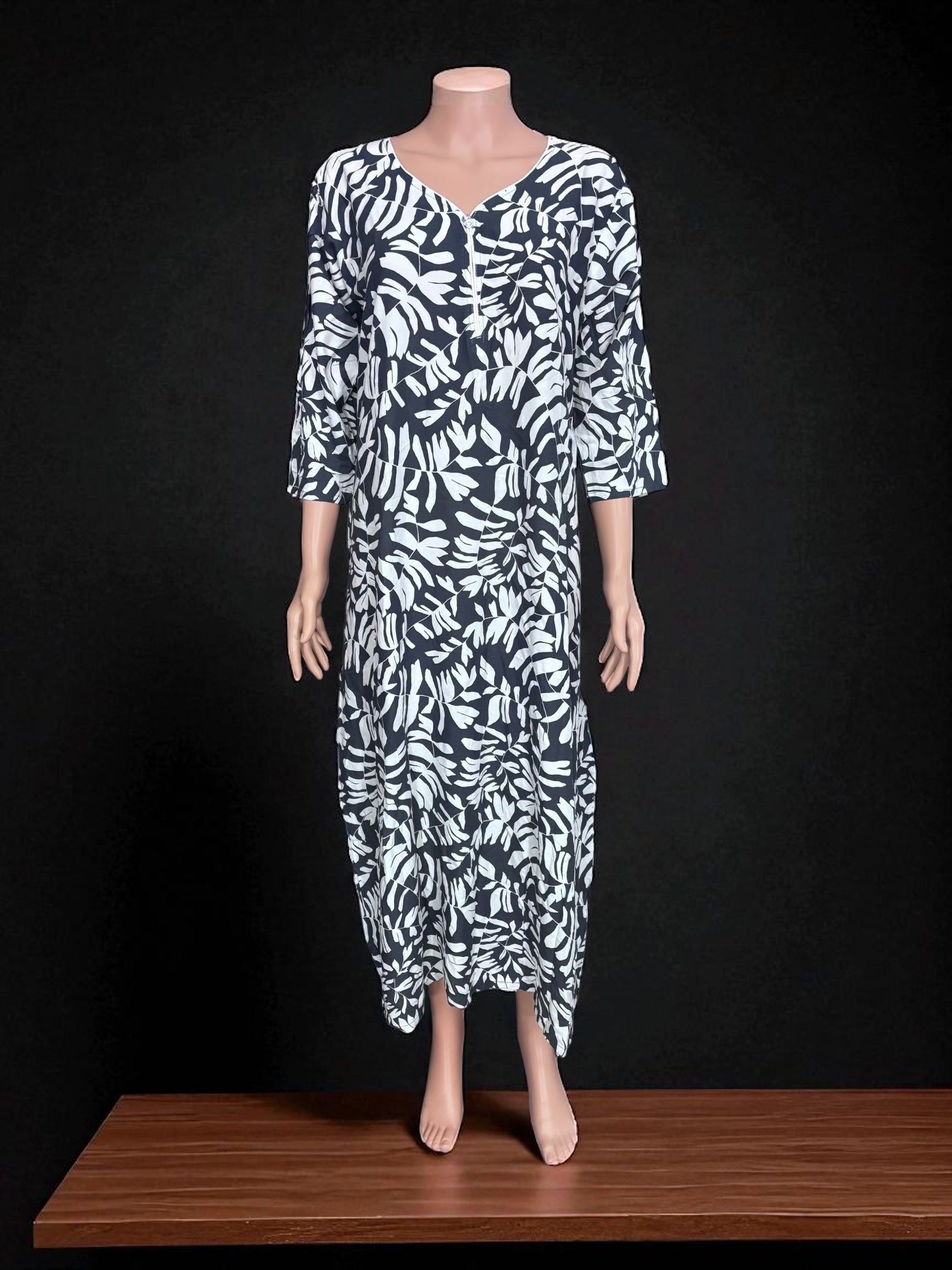 Traditional long Kurti from Saree Ghor Charlotte, cultural women’s salwar kameez with intricate embroidery and vibrant fabric.