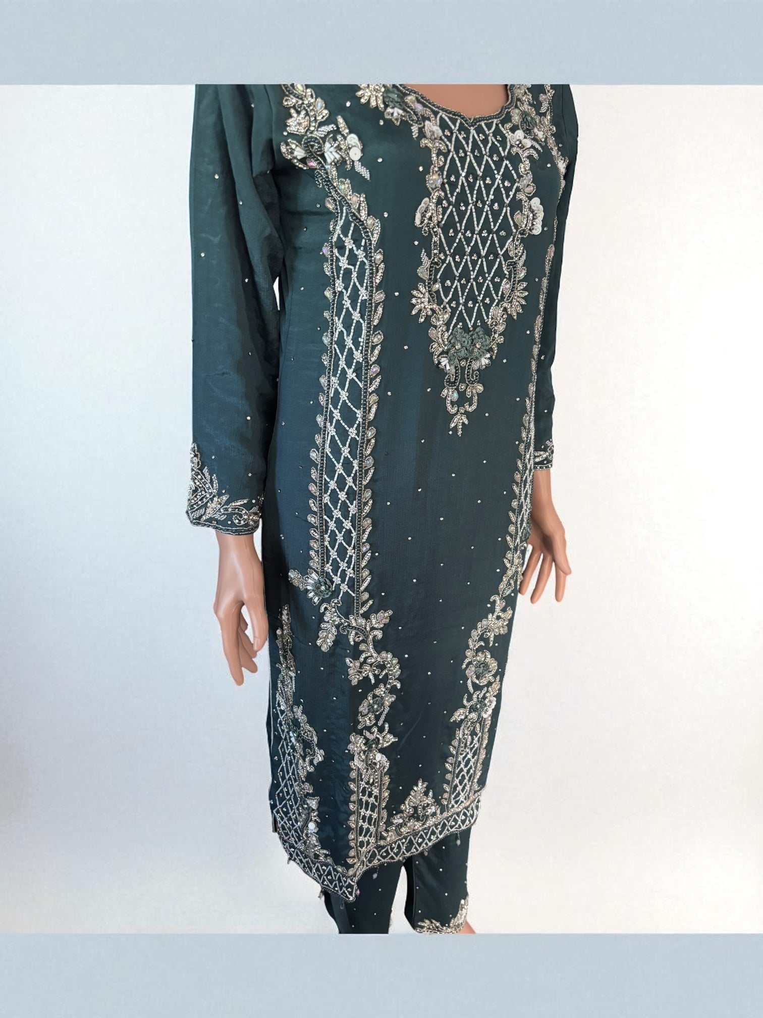 Elegant Heavy Work Salwar Kameez for women by Saree Ghor Charlotte, featuring intricate embroidery and traditional design.