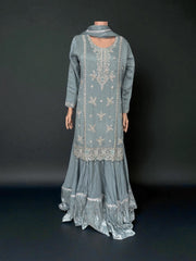Heavy Work Salwar Kameez by Saree Ghor Charlotte, traditional women's cultural wear with detailed embroidery and vibrant fabric.