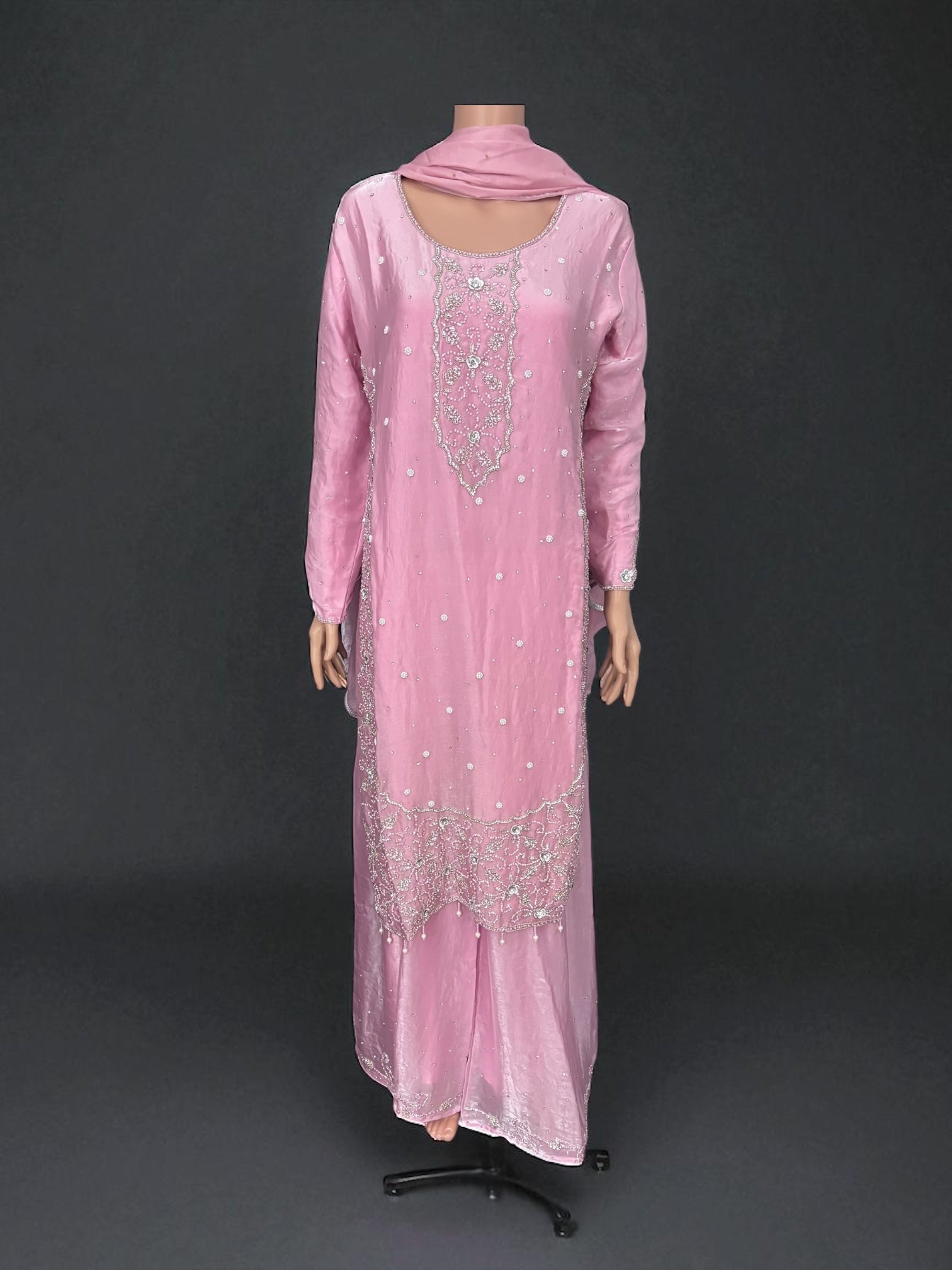 Heavy Work Salwar Kameez by Saree Ghor Charlotte, traditional women's cultural wear with intricate embroidery and vibrant fabric.
