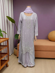 Heavy Work Salwar Kameez by Saree Ghor Charlotte, traditional women's cultural wear with intricate embroidery and vibrant fabric.