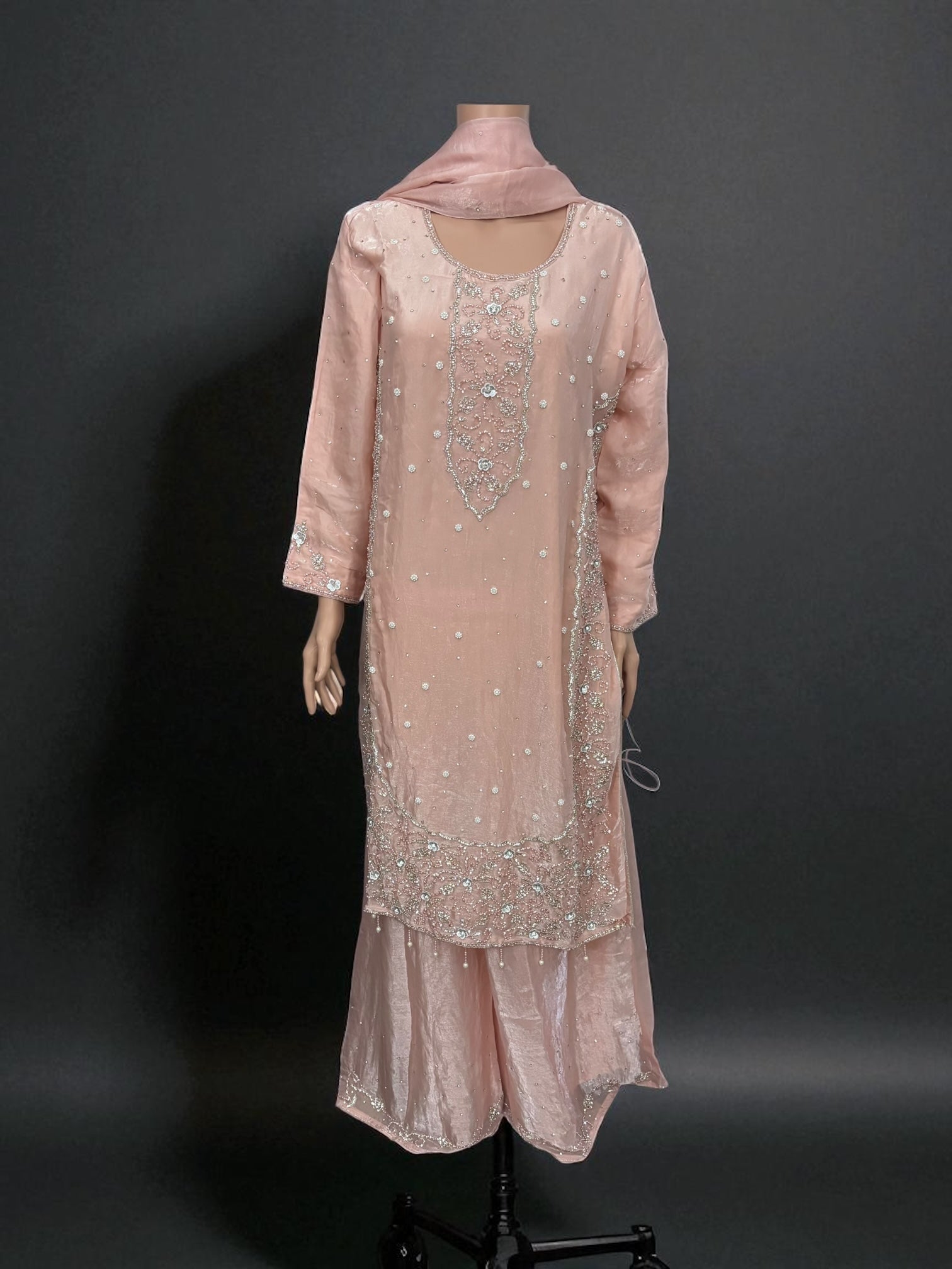Heavy Work Salwar Kameez by Saree Ghor Charlotte, traditional women's cultural wear with intricate embroidery and vibrant fabric.
