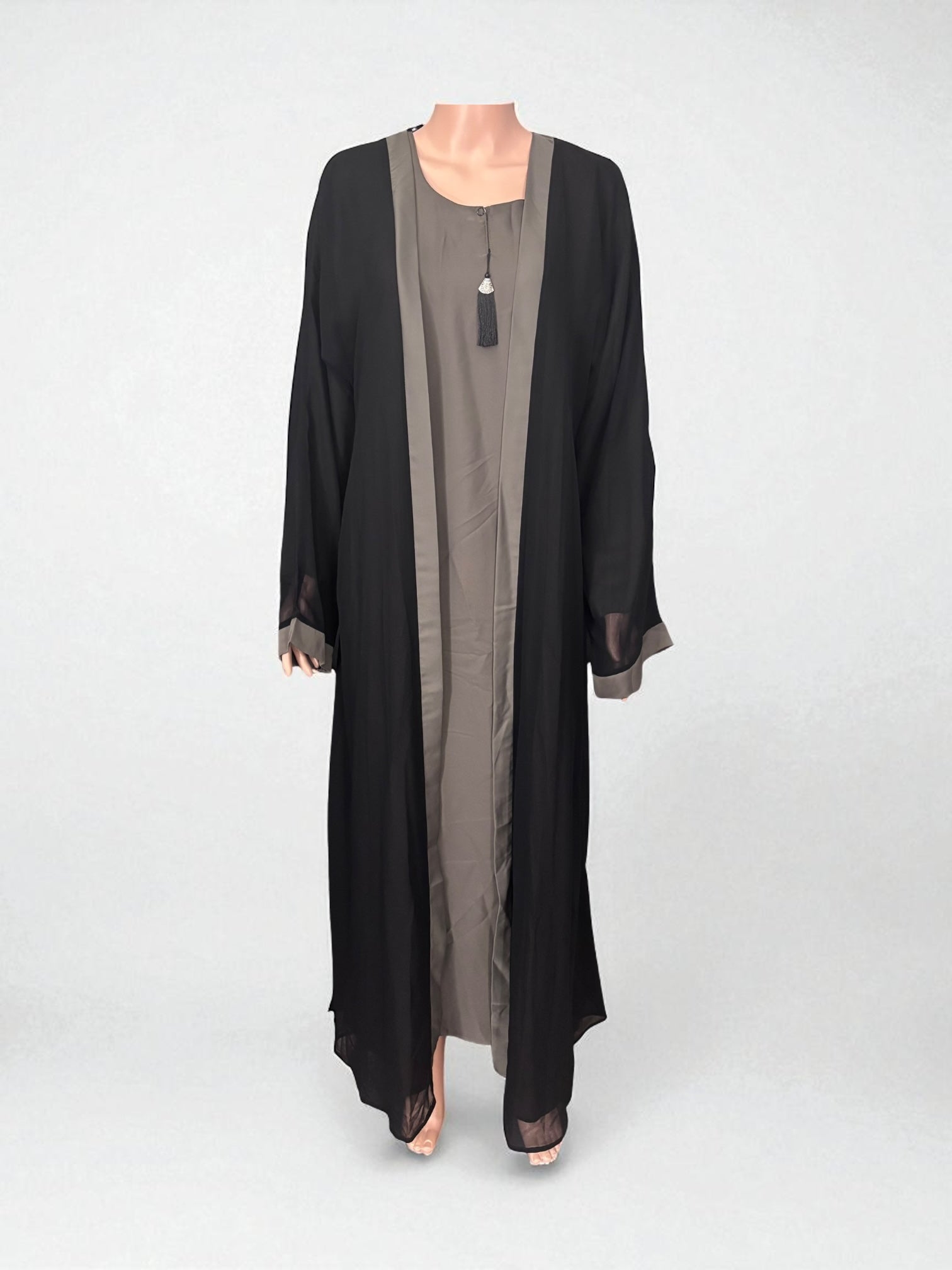 Women’s black Abaya Burqa by Saree Ghor Charlotte, modest Islamic dress with flowing fabric and elegant design, shown in front view.