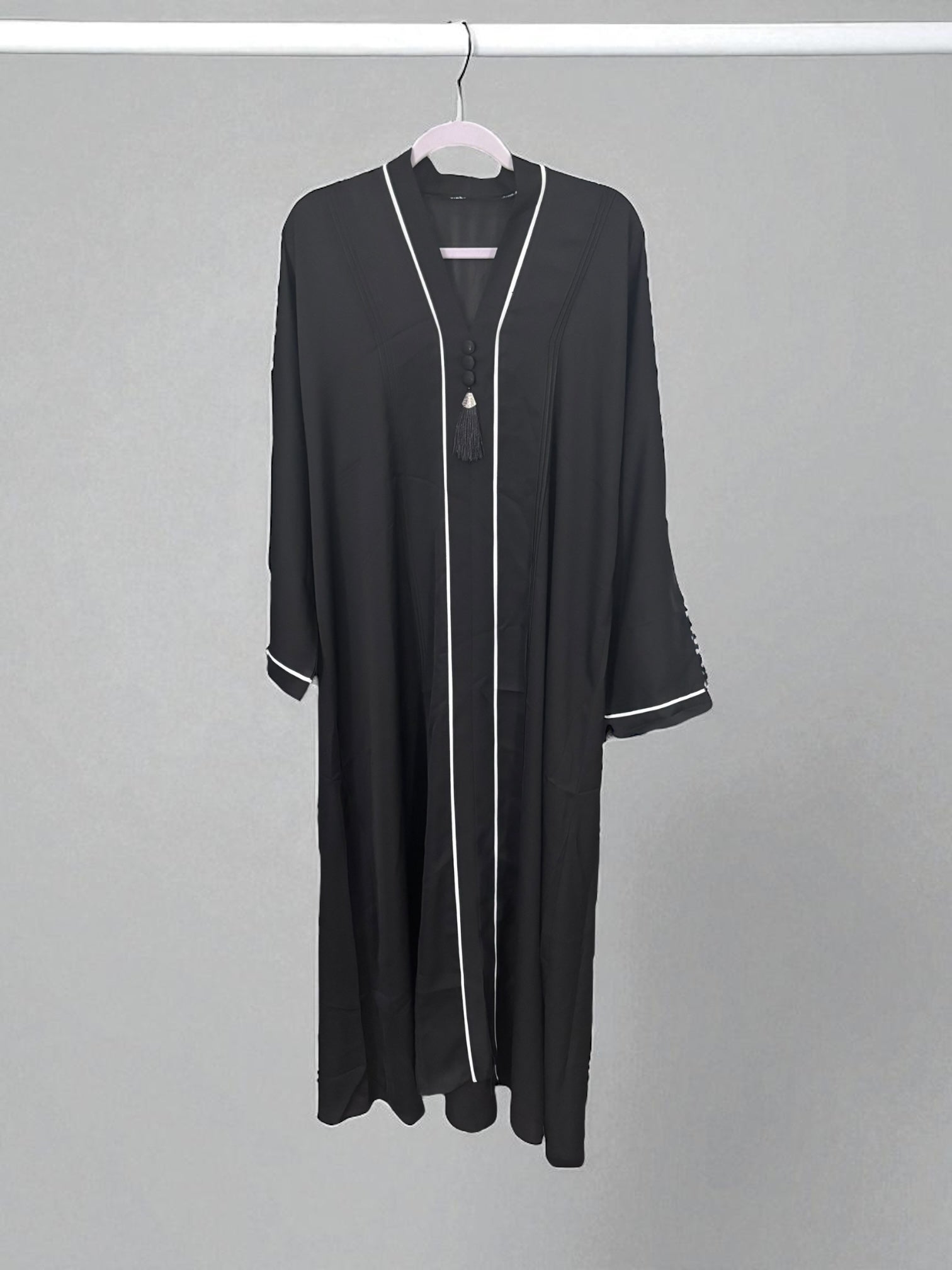Women’s black Abaya Burqa by Saree Ghor Charlotte, modest Islamic dress with flowing fabric, full-length coverage, and intricate embroidery.