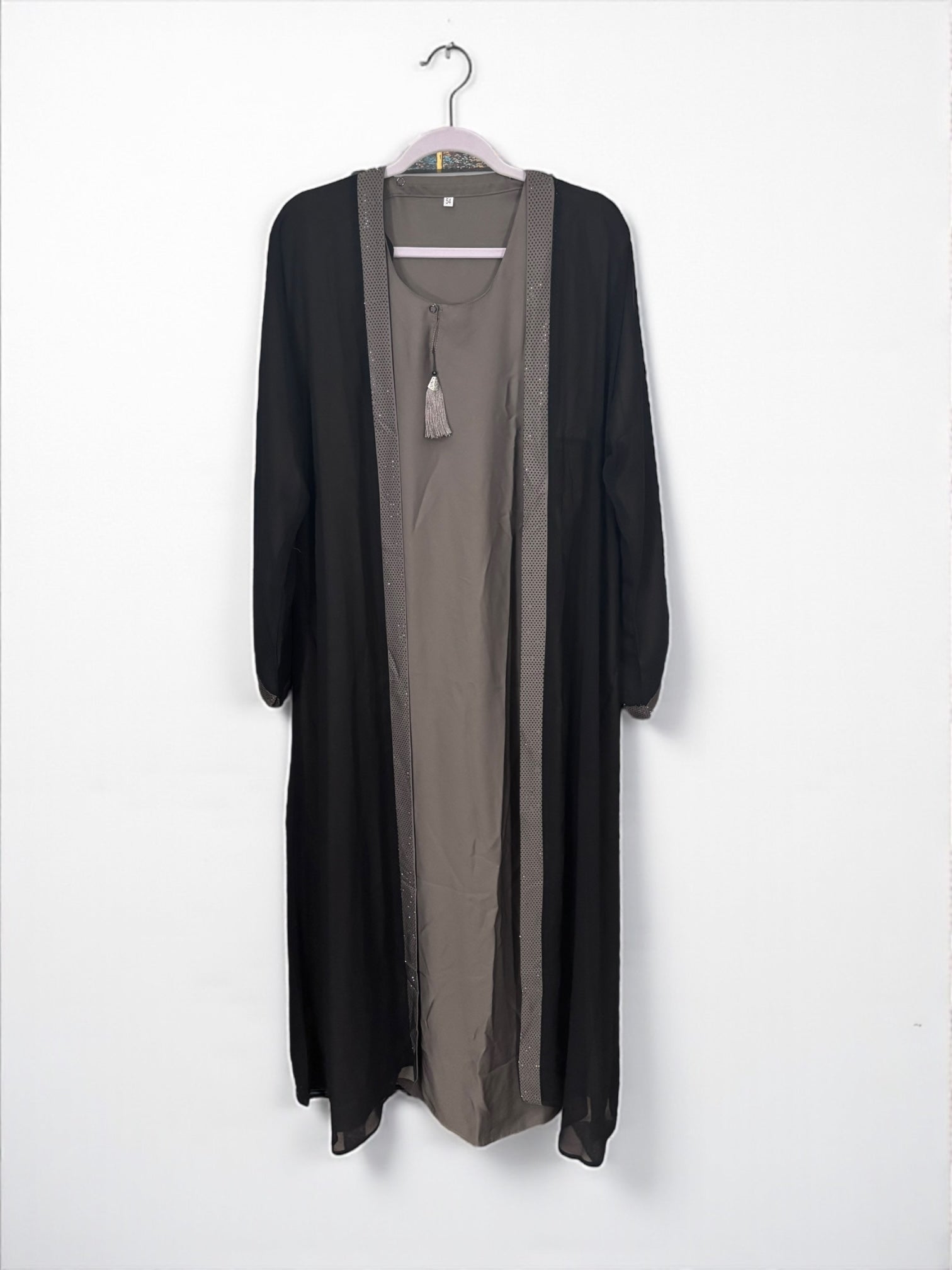 Women’s black Abaya Burqa by Saree Ghor Charlotte featuring modest Islamic dress with elegant drape and intricate embroidery.