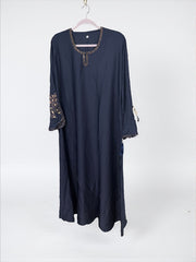 Women’s black abaya burqa by Saree Ghor Charlotte, modest Islamic dress with flowing fabric and elegant design.
