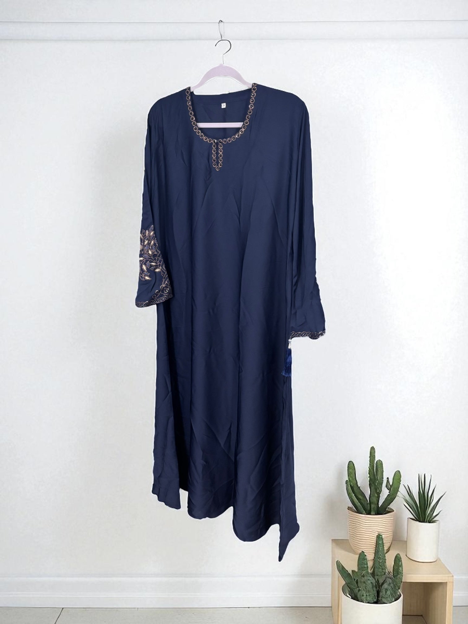 Women’s black Abaya Burqa by Saree Ghor Charlotte, modest Islamic dress with flowing fabric and elegant design.