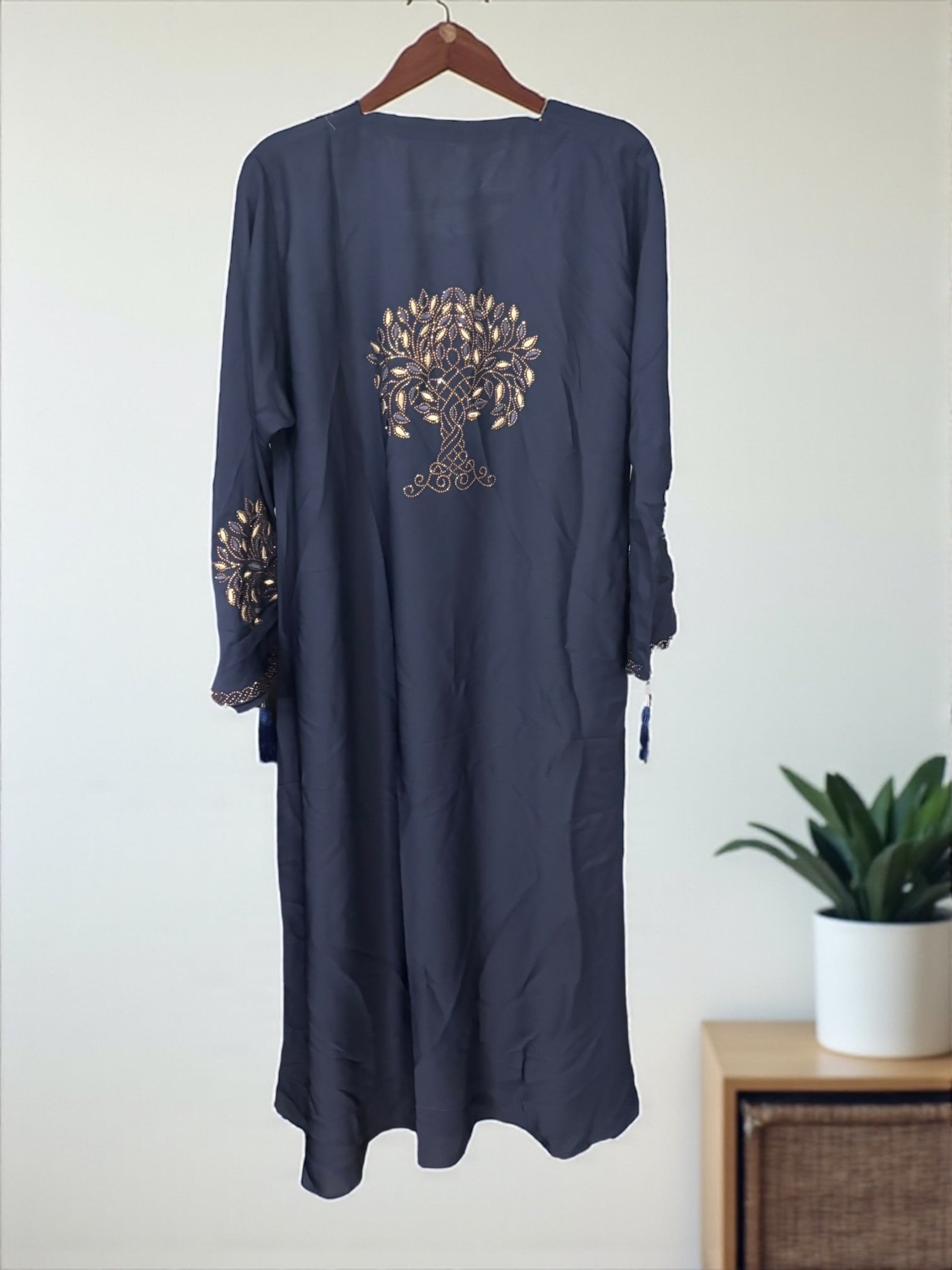 Women’s black Abaya Burqa by Saree Ghor Charlotte, modest Islamic dress with flowing fabric and full-length coverage.