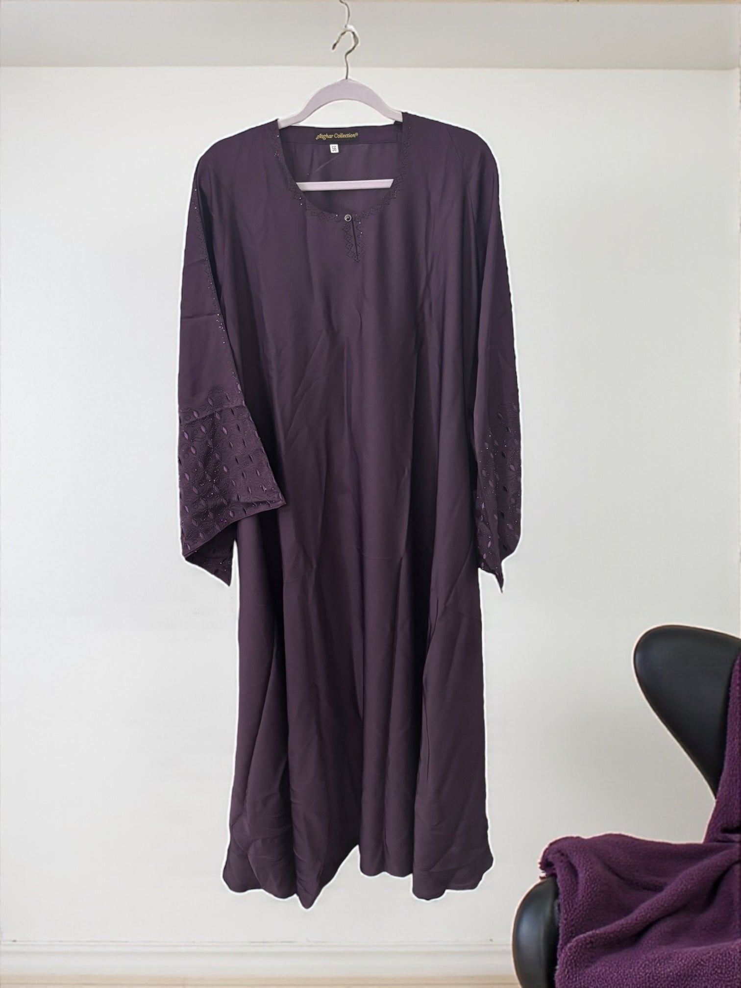 Women’s black abaya burqa by Saree Ghor Charlotte, modest Islamic dress with flowing fabric and elegant design.