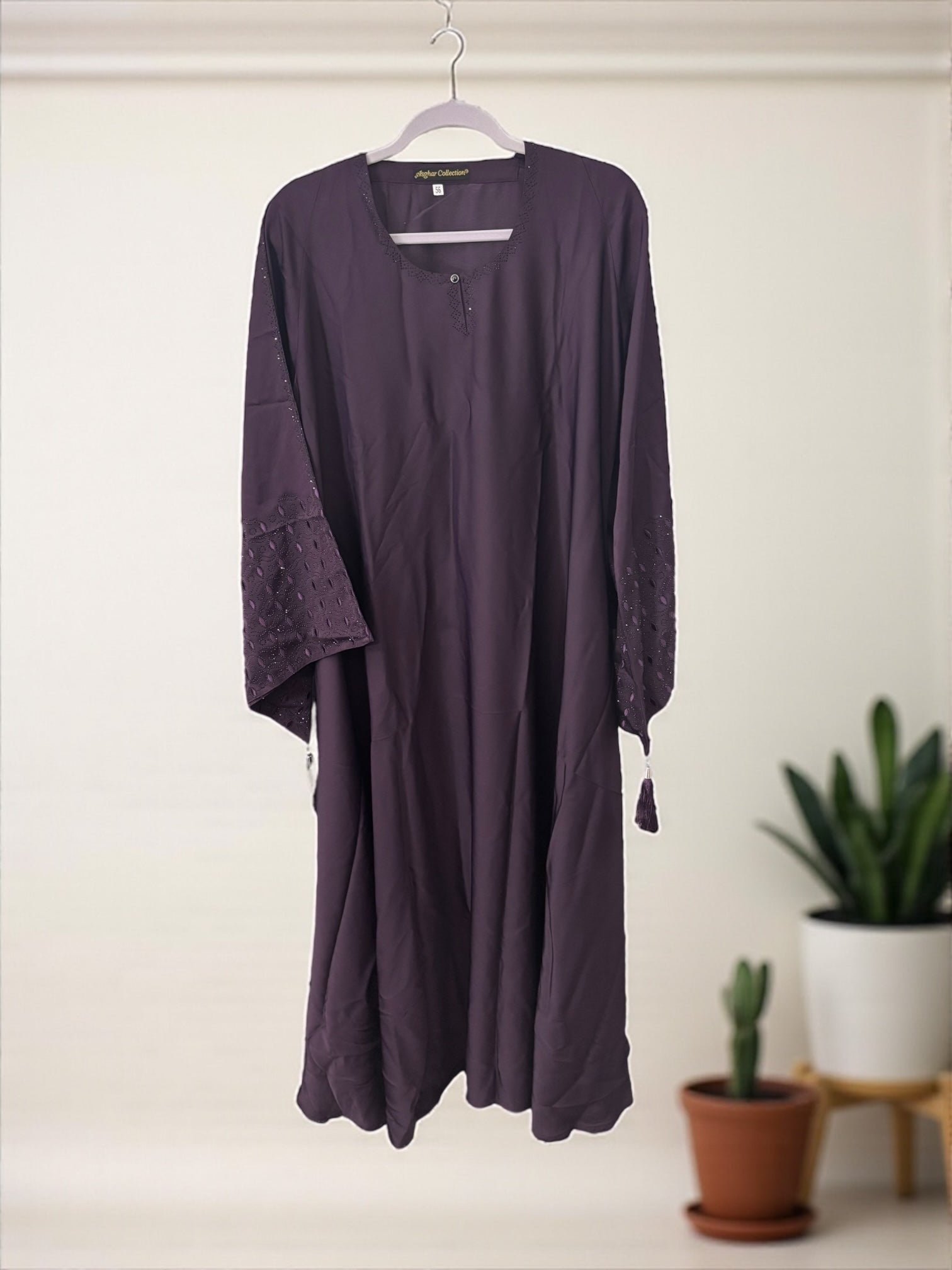 Women’s black Abaya Burqa by Saree Ghor Charlotte, modest Islamic dress with flowing fabric and elegant design.