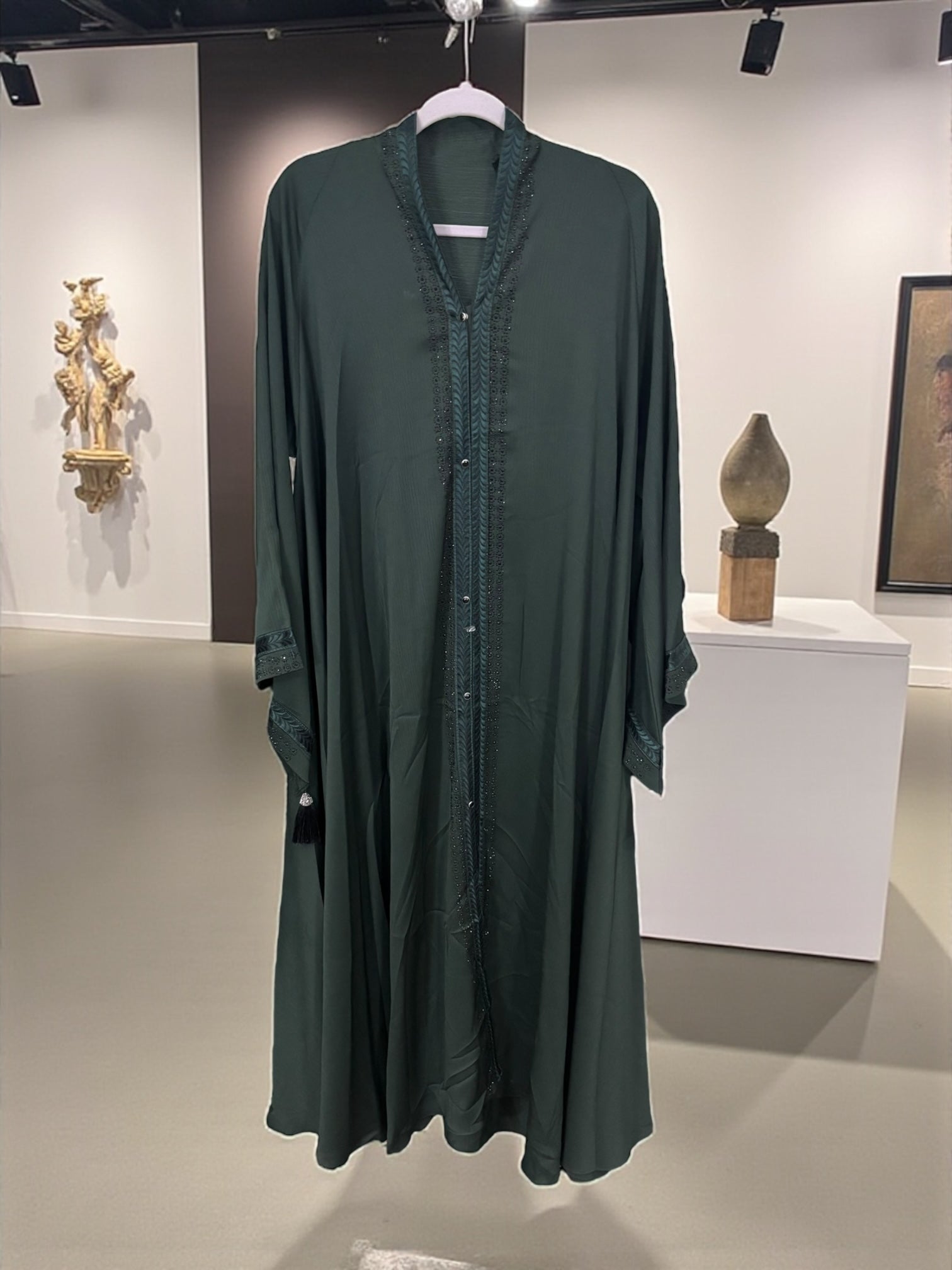 Women’s black Abaya Burqa by Saree Ghor Charlotte, modest Islamic dress with flowing fabric and elegant design.