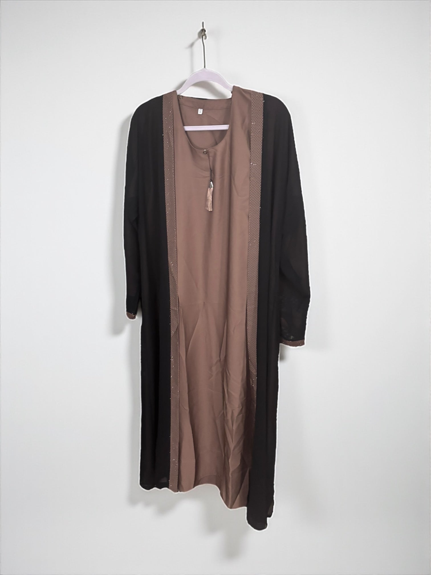 Women’s black Abaya Burqa by Saree Ghor Charlotte, modest Islamic dress with flowing fabric and elegant design.