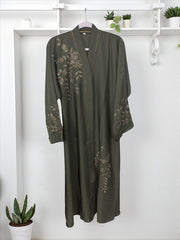 Women’s black abaya burqa by Saree Ghor Charlotte, modest Islamic dress with intricate embroidery and flowing fabric.