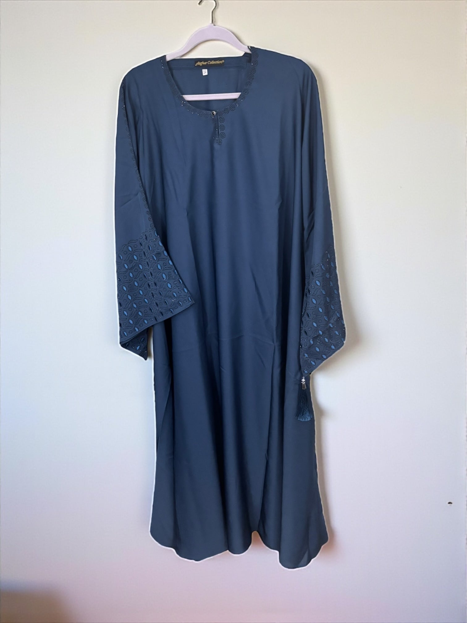 Women’s black Abaya Burqa from Saree Ghor Charlotte, modest Islamic dress with flowing fabric and full-length coverage.