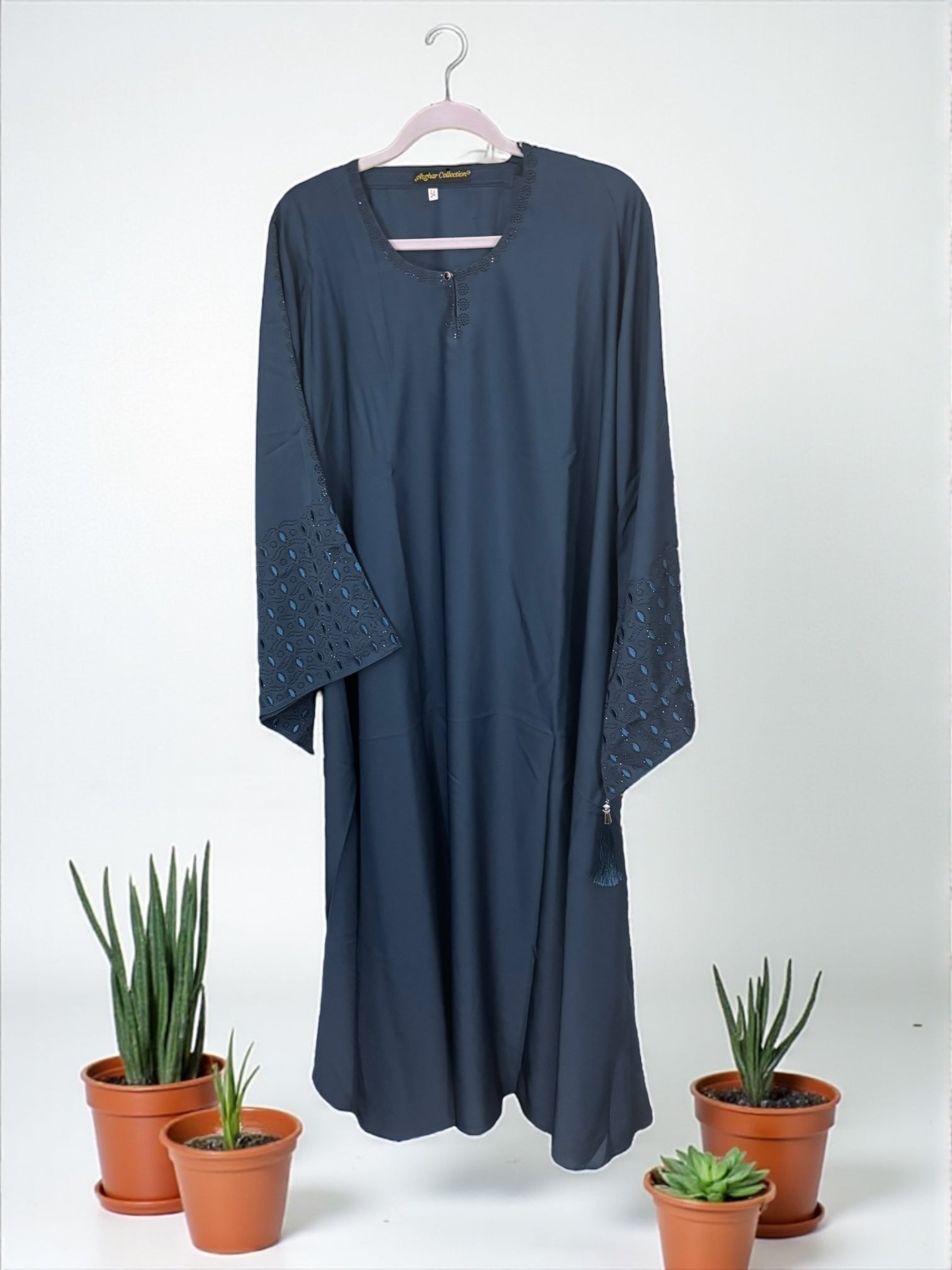 Women’s black Abaya Burqa by Saree Ghor Charlotte, modest Islamic dress with flowing fabric and full-length coverage.