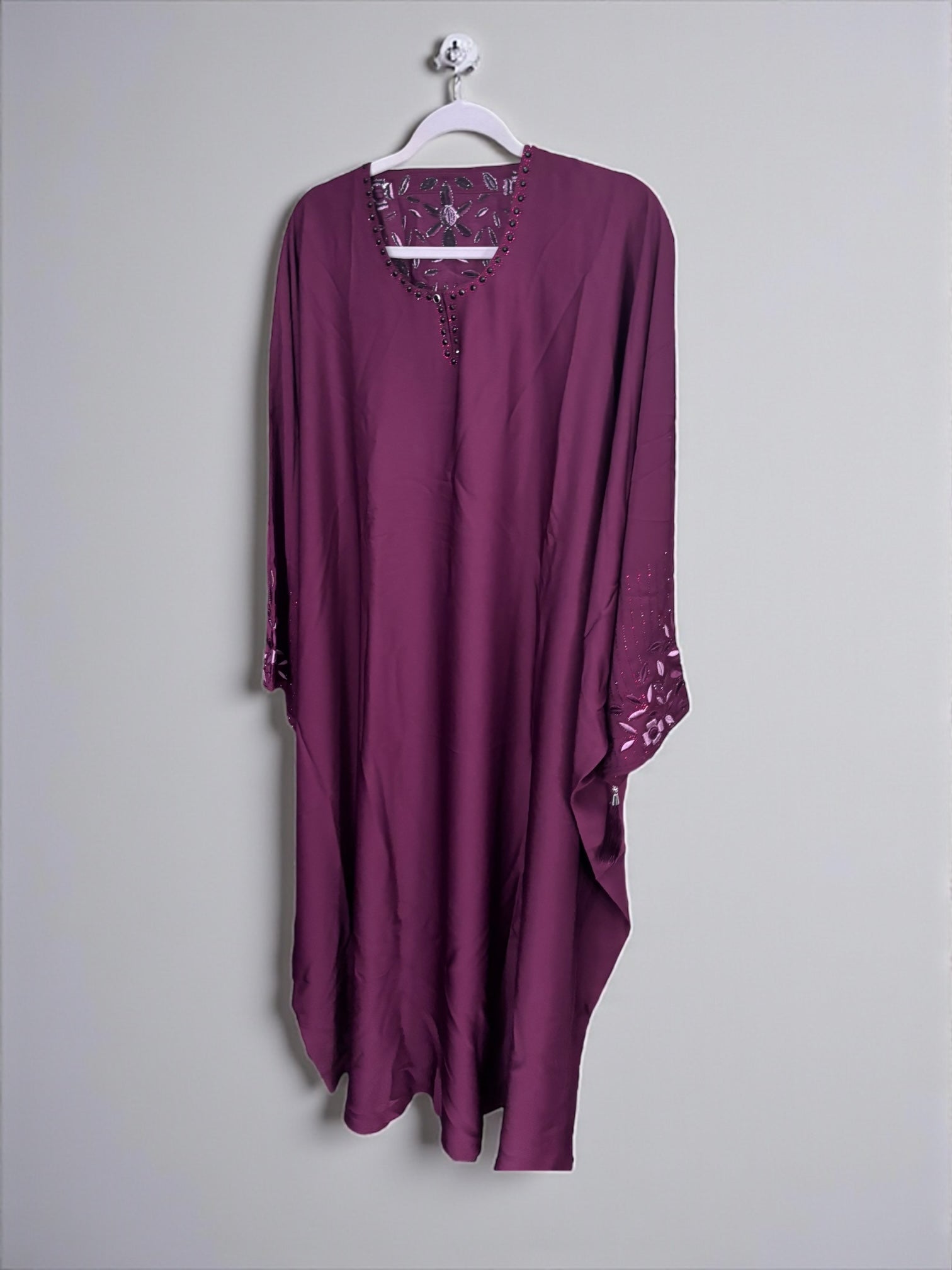 Women’s black kaftan abaya by Saree Ghor Charlotte, modest Islamic dress with flowing fabric and elegant design.