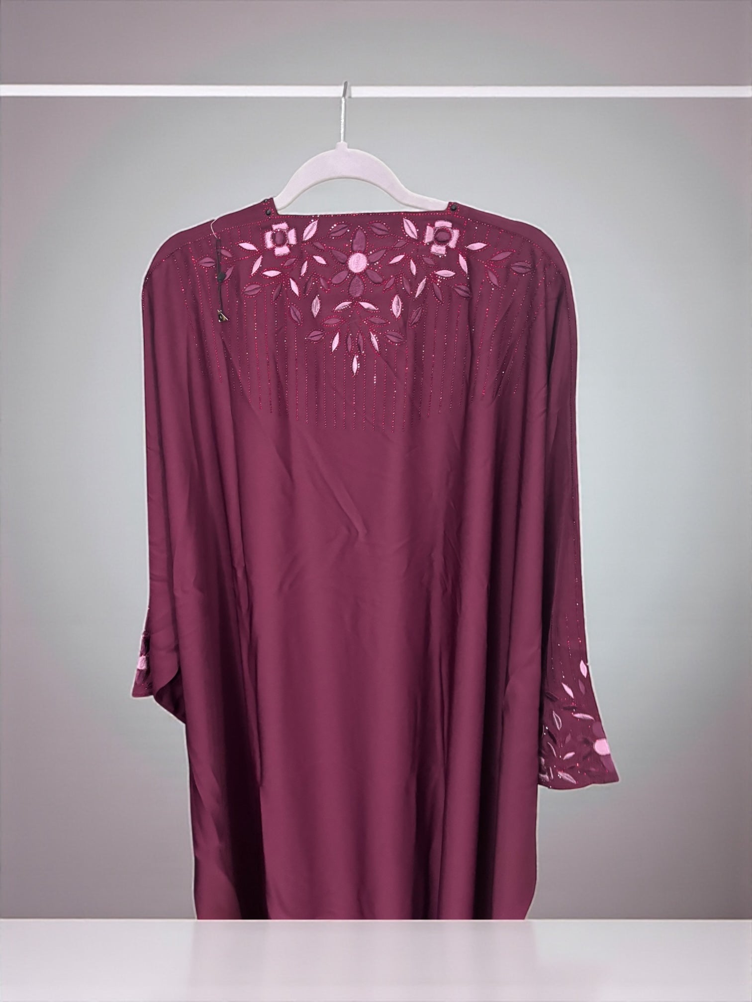 Women’s black kaftan abaya by Saree Ghor Charlotte, modest Islamic dress with intricate embroidery, flowing fabric, and elegant design.